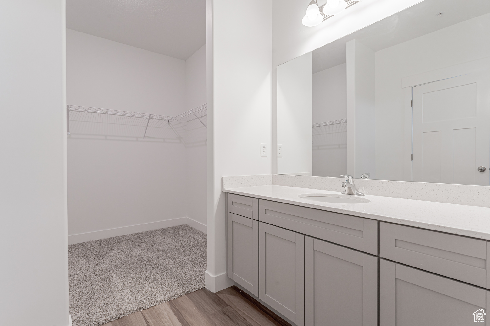 Bathroom with vanity and hardwood / wood-style floors