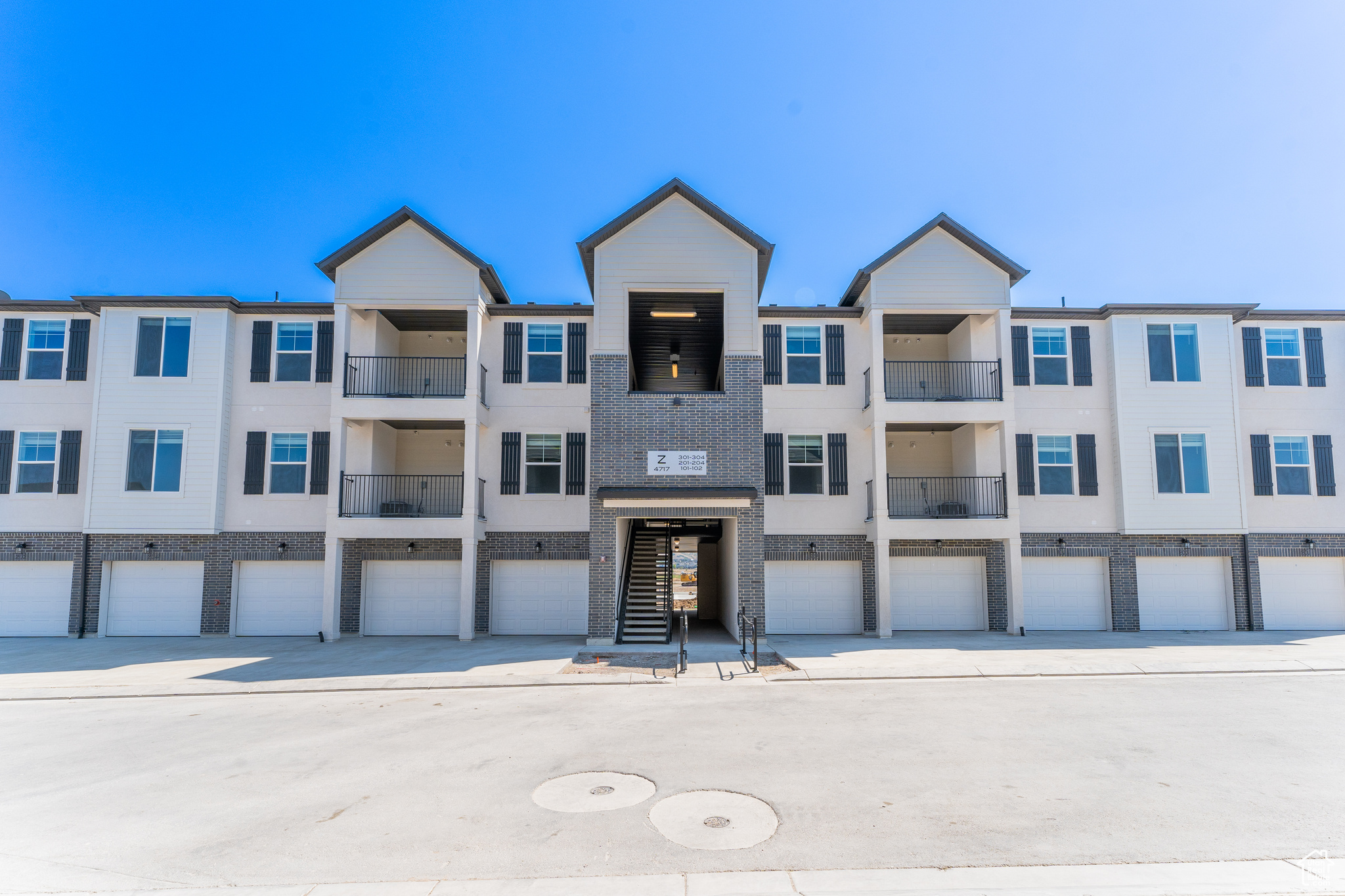 View of building exterior featuring a garage