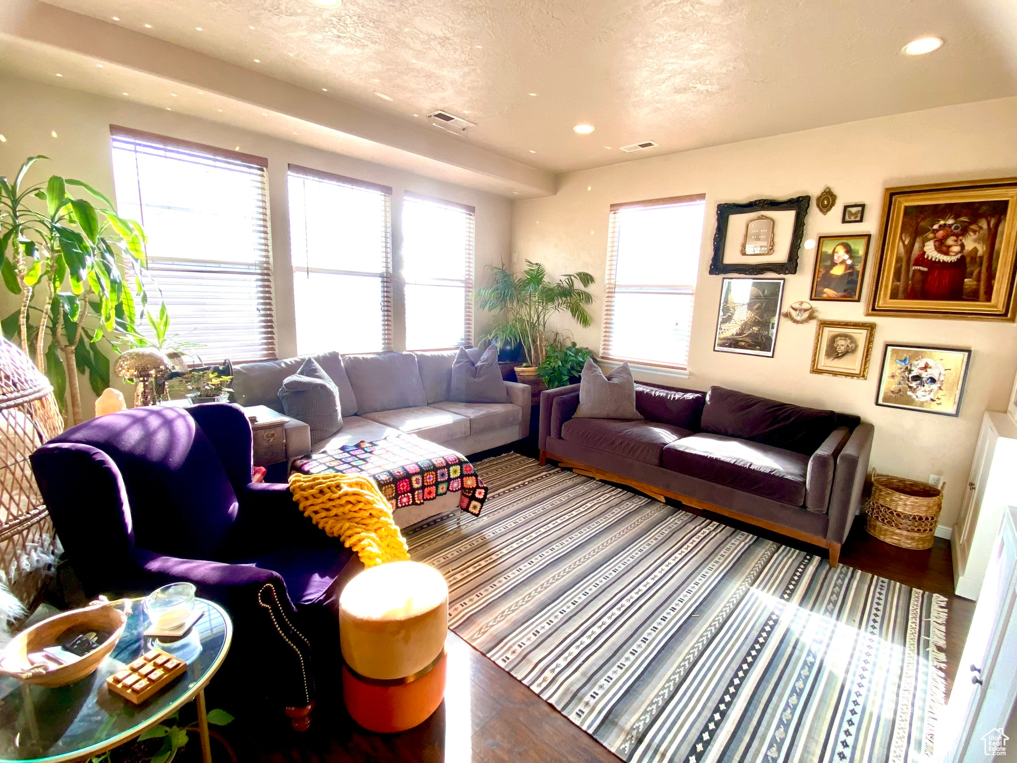 Living room featuring hardwood / wood-style flooring and a healthy amount of sunlight