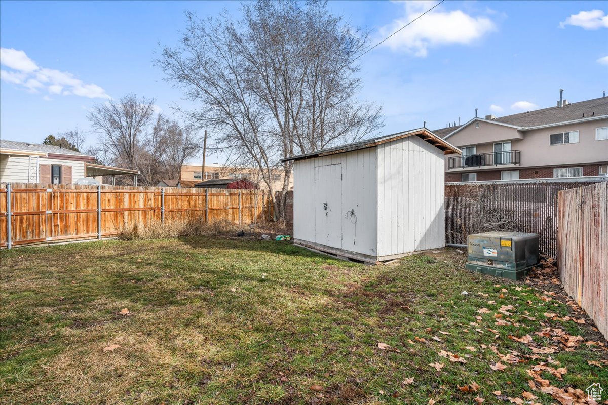 View of yard featuring a storage unit