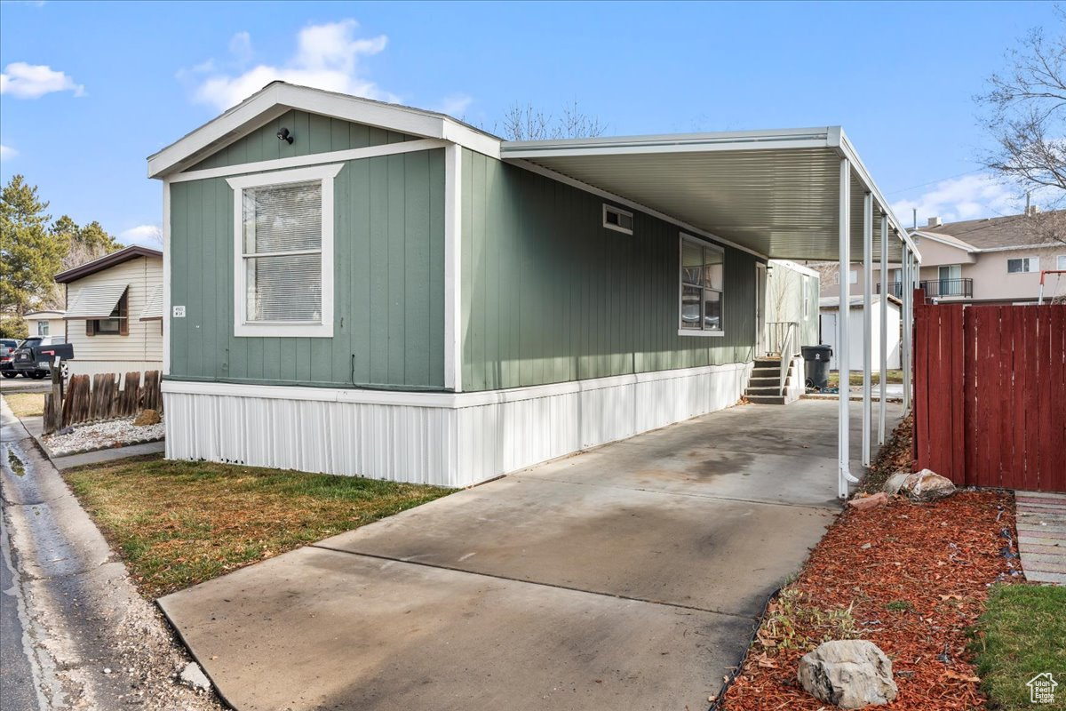 Exterior space featuring a carport