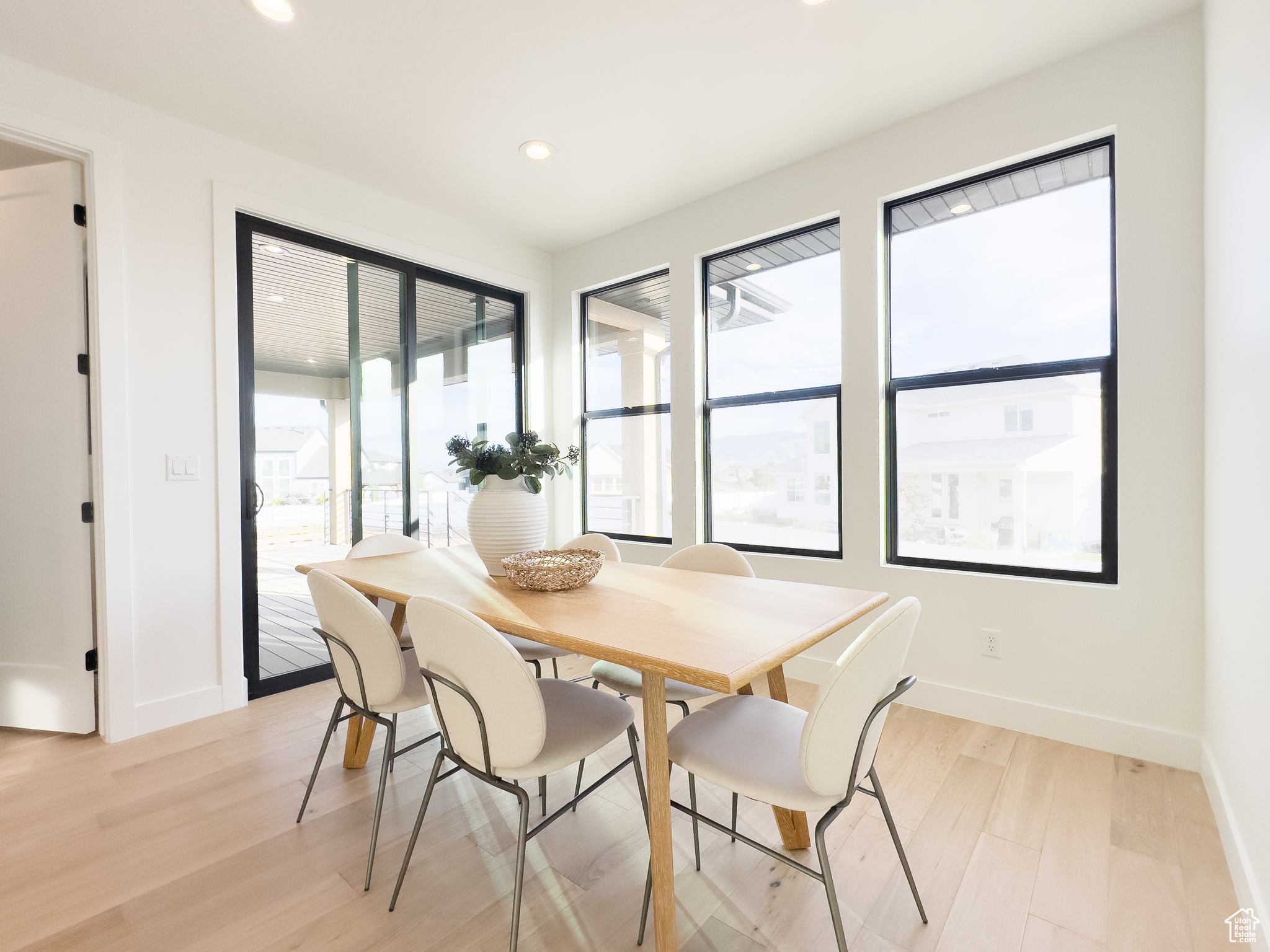 Dining area featuring a healthy amount of sunlight and light hardwood / wood-style flooring