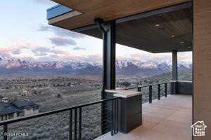 Balcony at dusk with a mountain view