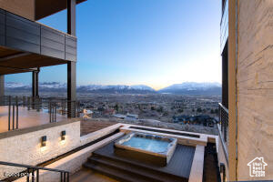 Balcony featuring an outdoor hot tub