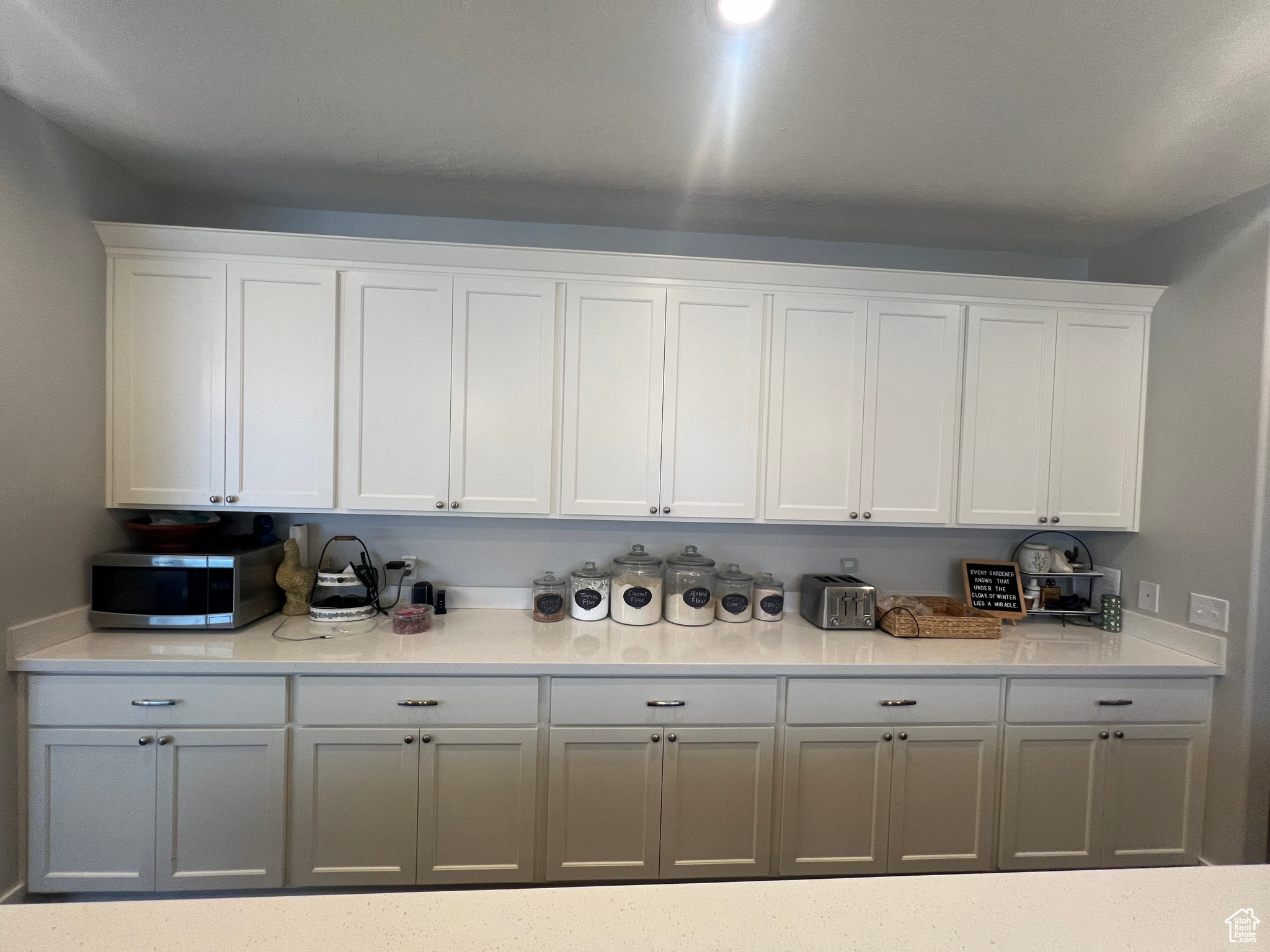 Kitchen featuring white cabinets