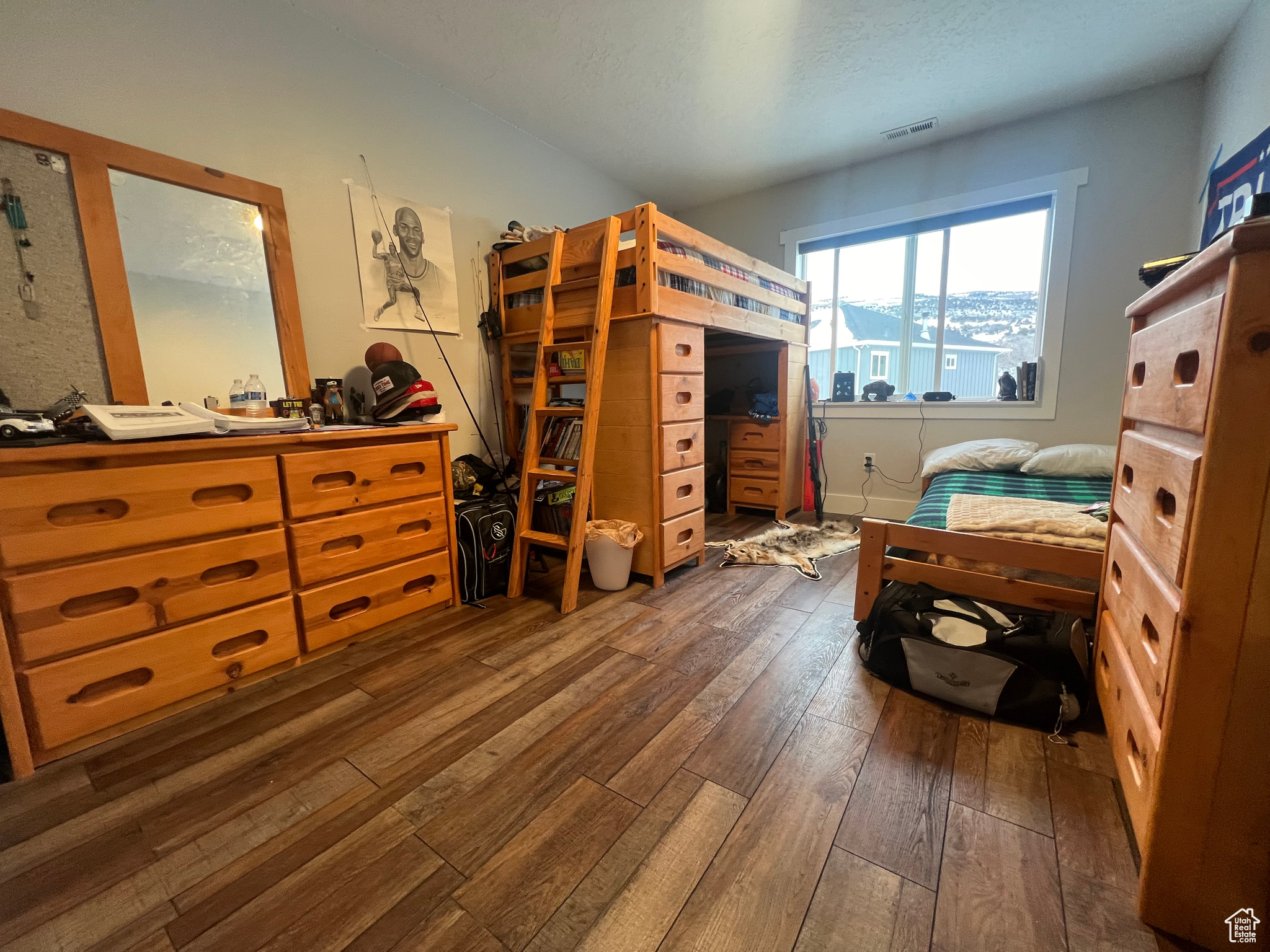 Bedroom with dark wood-type flooring