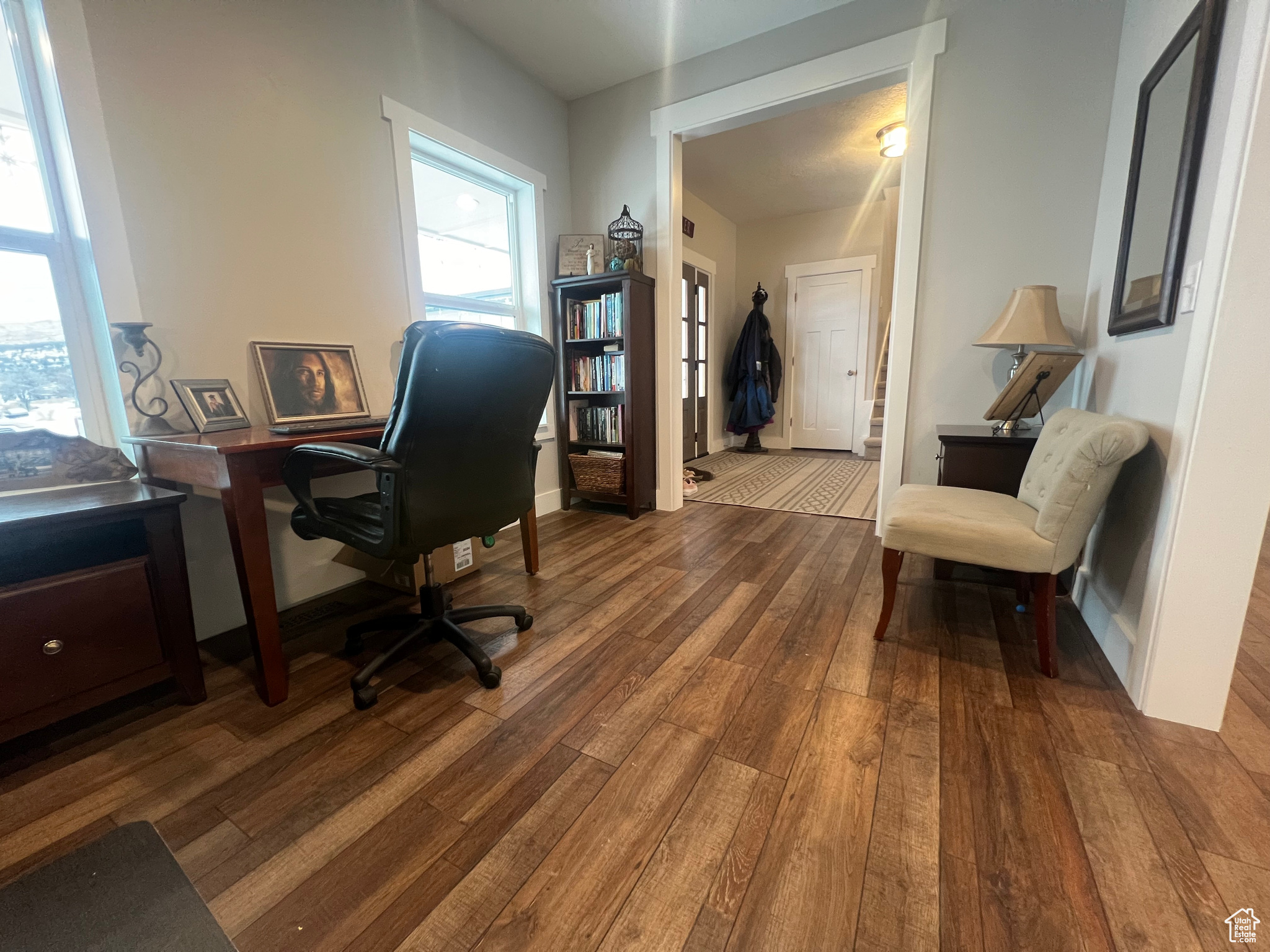 Office area featuring french doors, light hardwood / wood-style flooring, and a healthy amount of sunlight