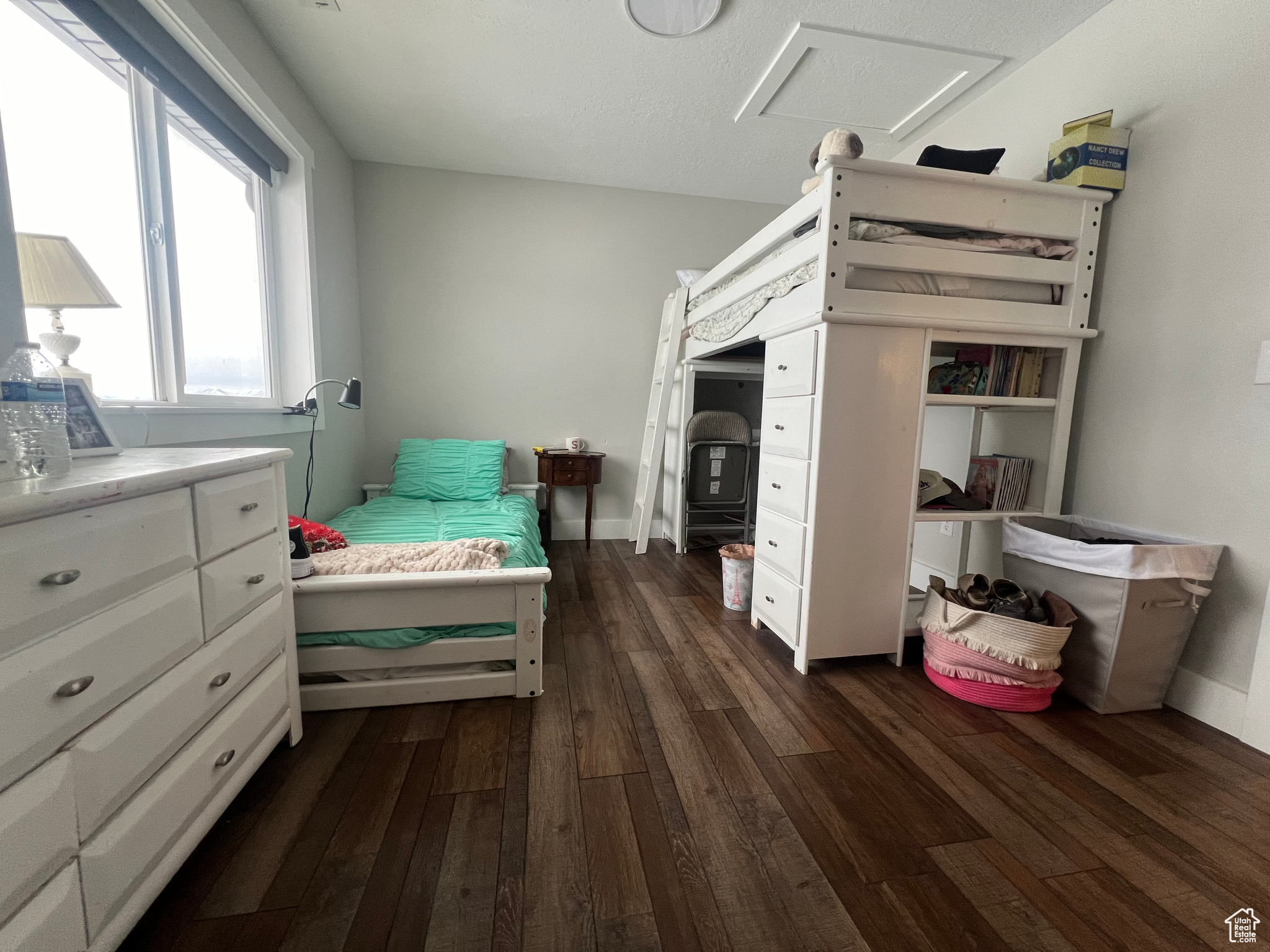 Bedroom featuring dark wood-type flooring