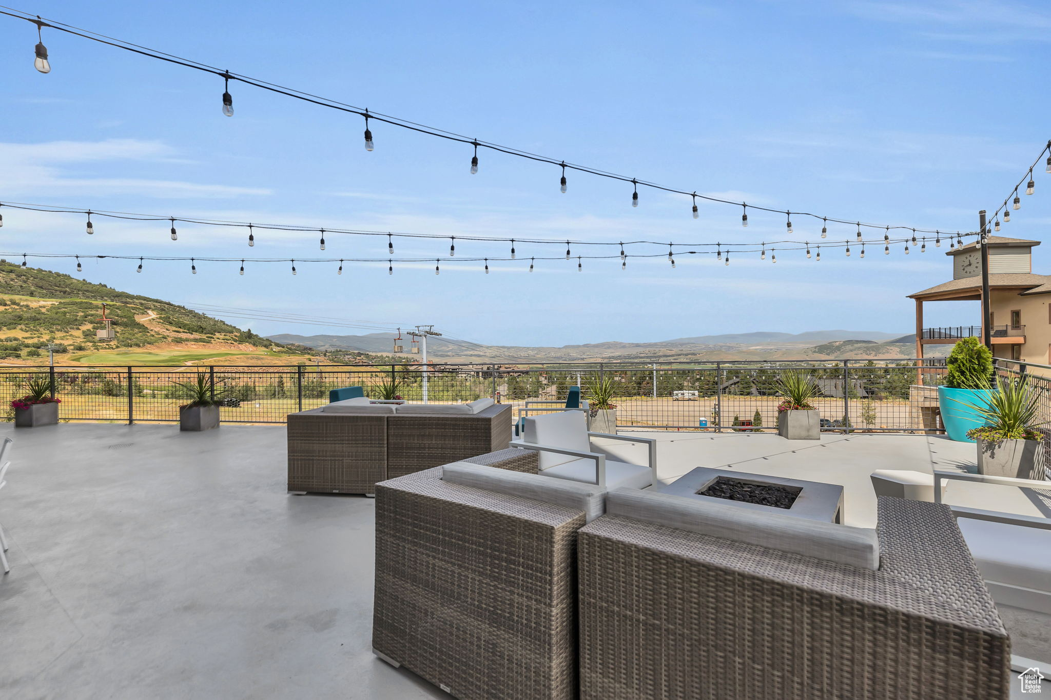 View of terrace with a mountain view and an outdoor living space with a fire pit