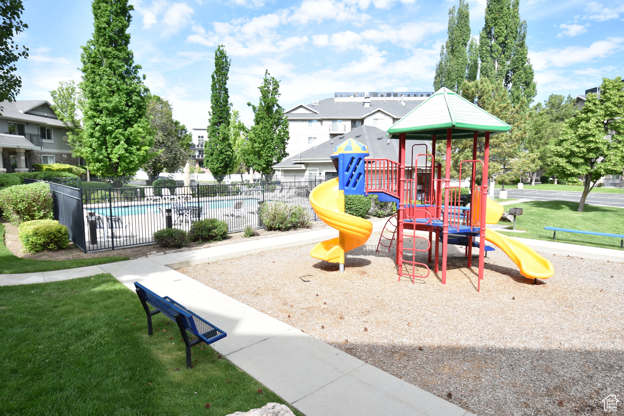 View of play area featuring a community pool