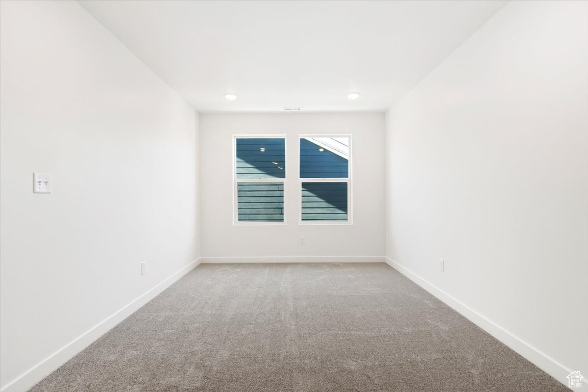 Empty room featuring carpet