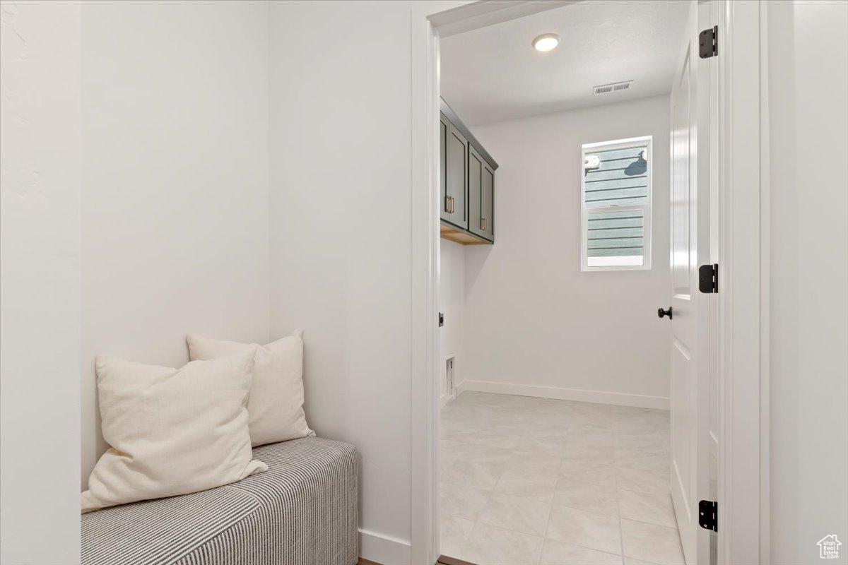 Mud room featuring light tile flooring