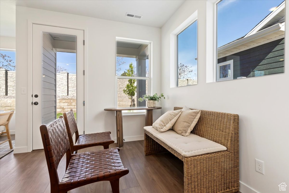 Sitting room featuring dark wood-type flooring