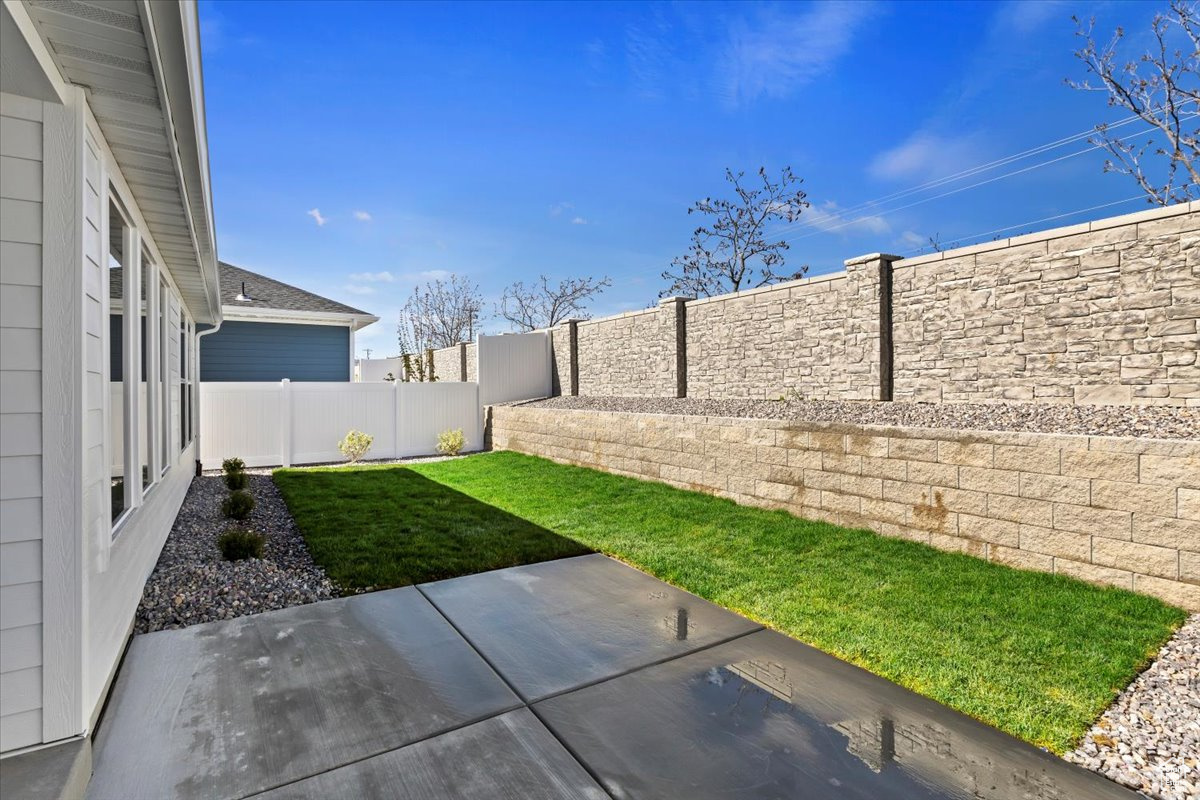 View of yard with a patio area