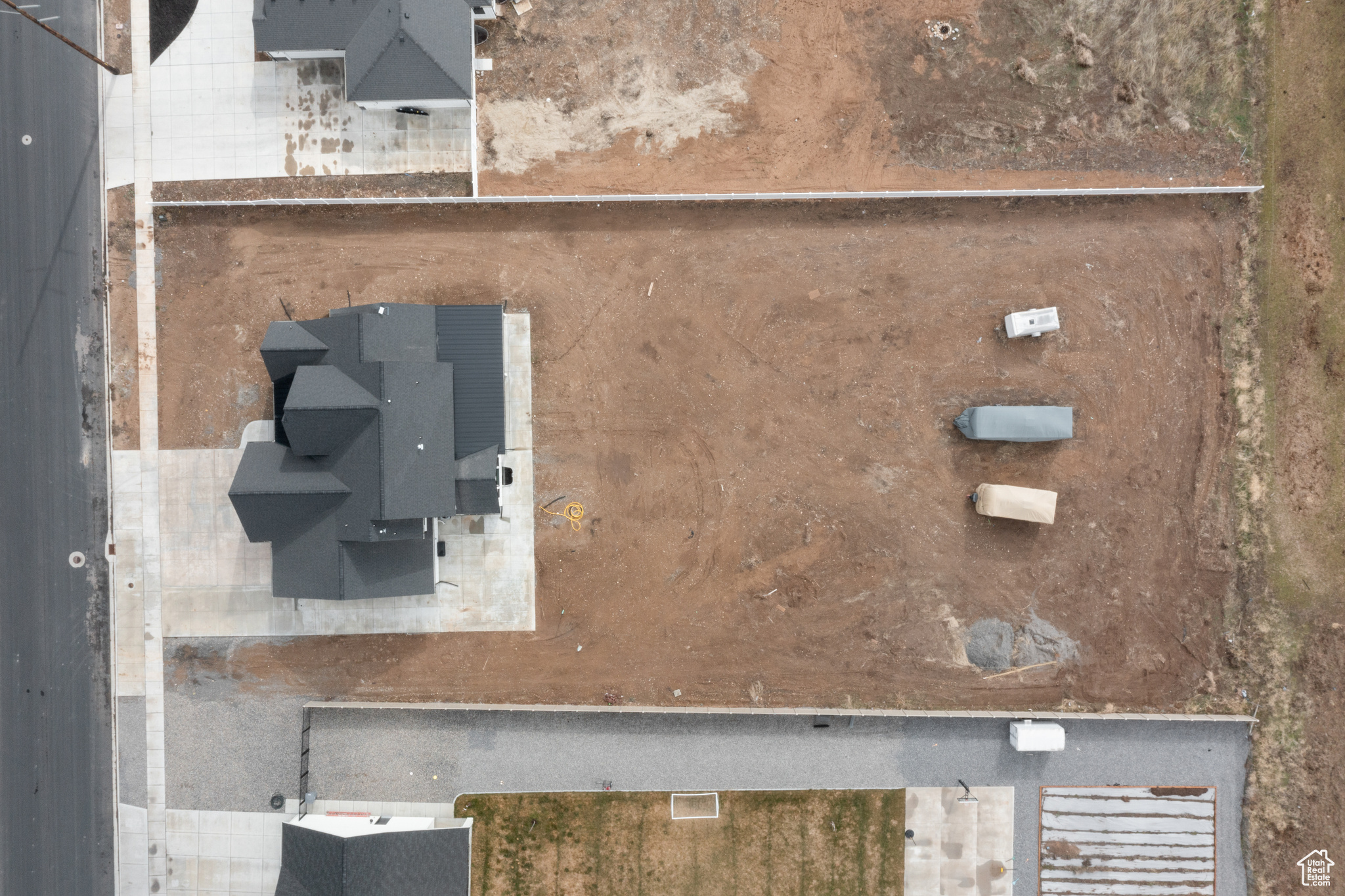 Aerial view of house on lot