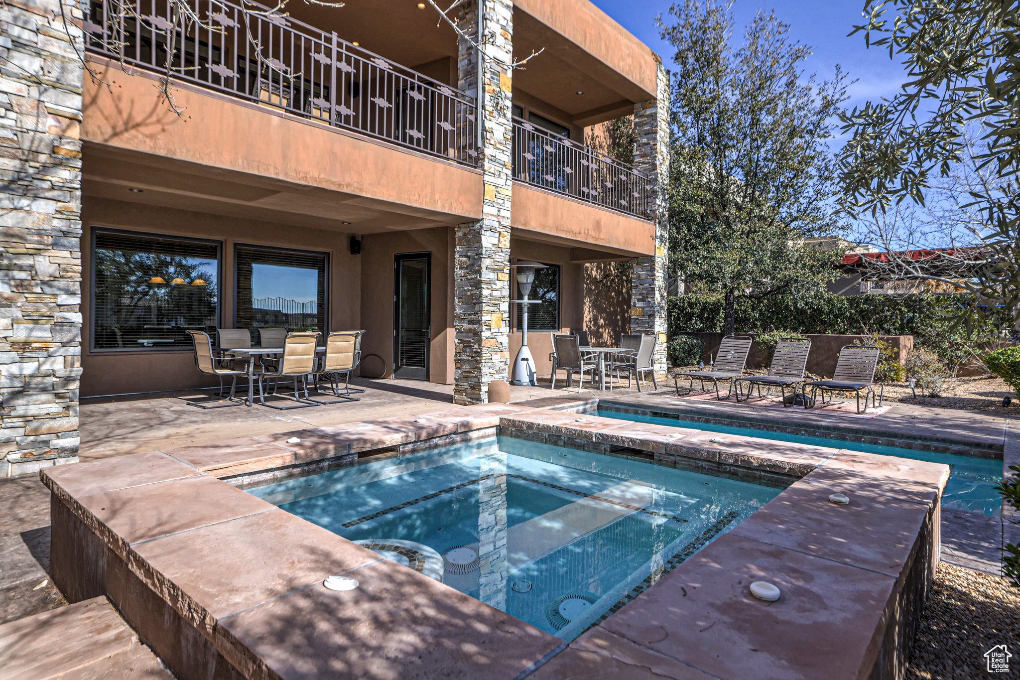 View of pool featuring an in ground hot tub and a patio area