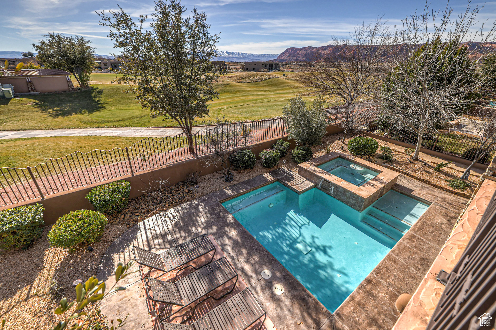 View of swimming pool featuring a mountain view, a lawn, a patio area, and an in ground hot tub