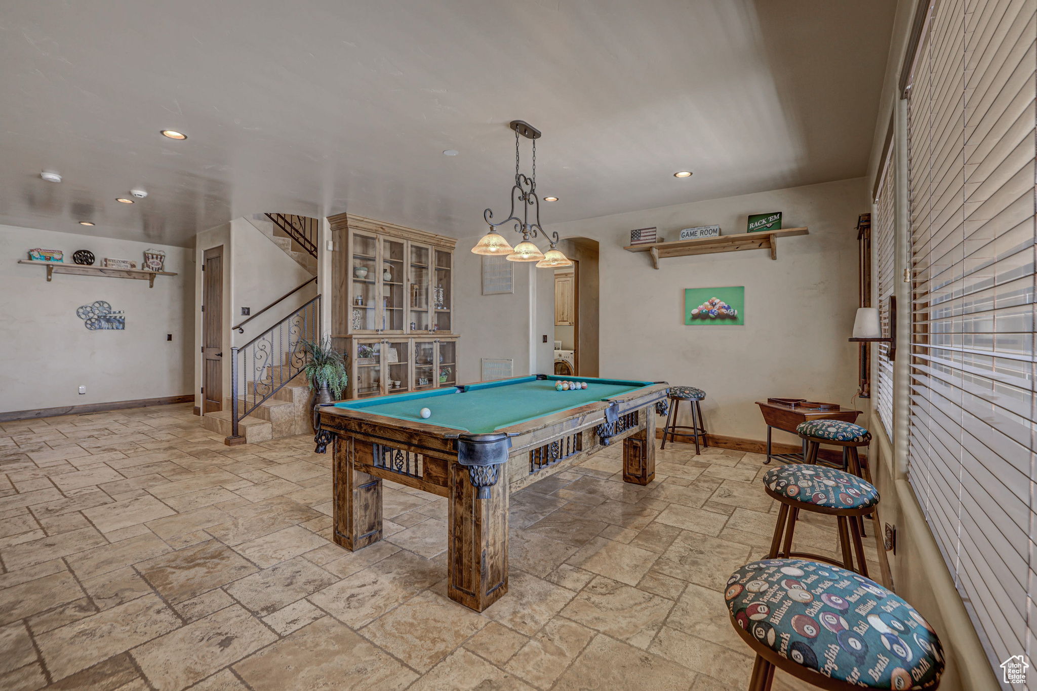 Recreation room with billiards and light tile floors