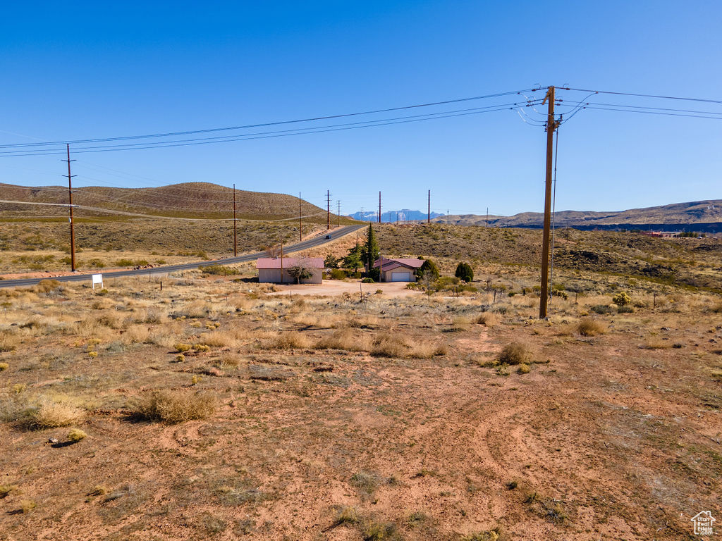 Property view of mountains with a rural view