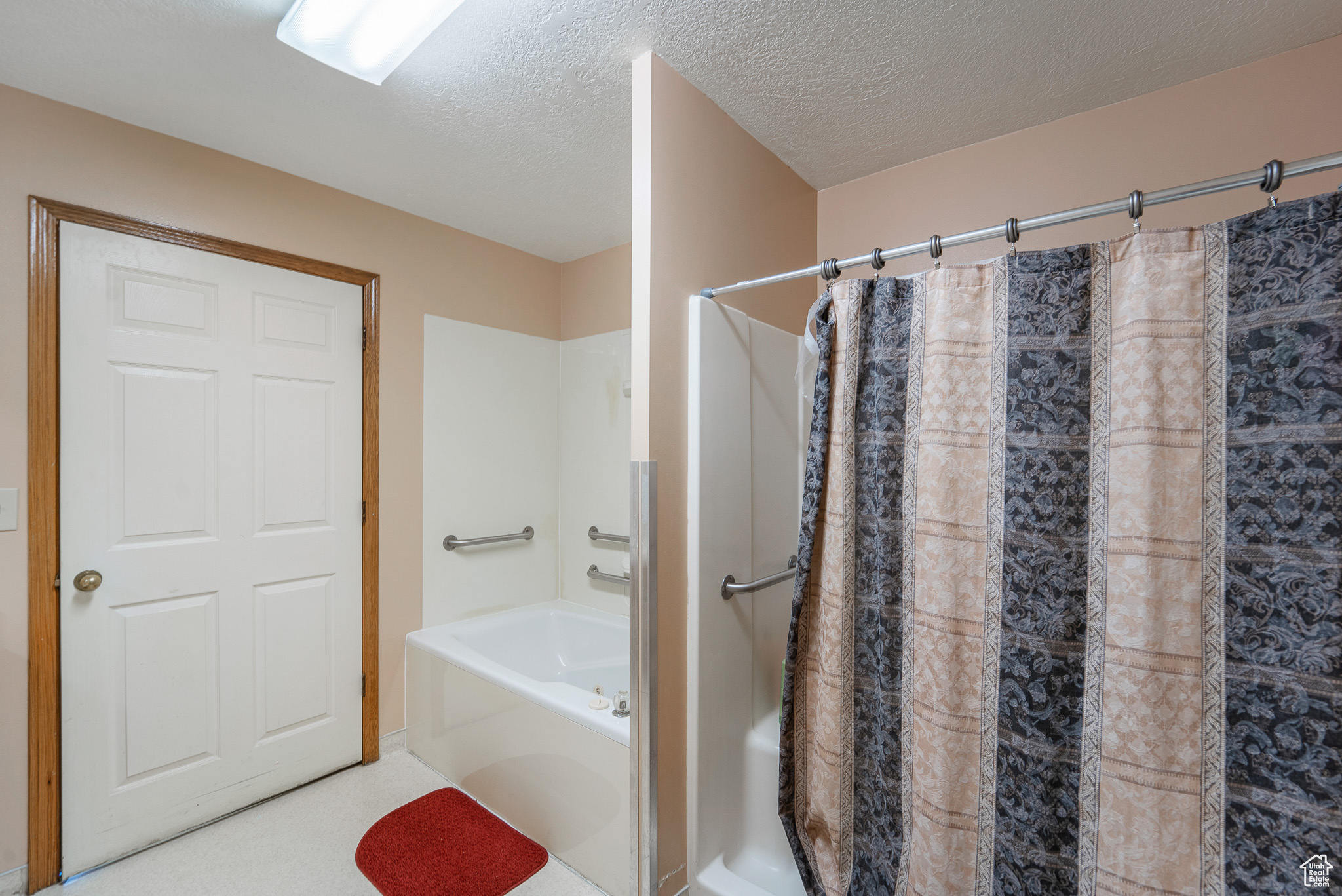 Bathroom featuring a textured ceiling