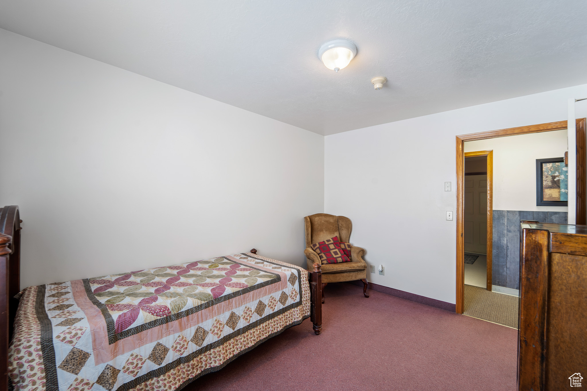 Bedroom with dark carpet