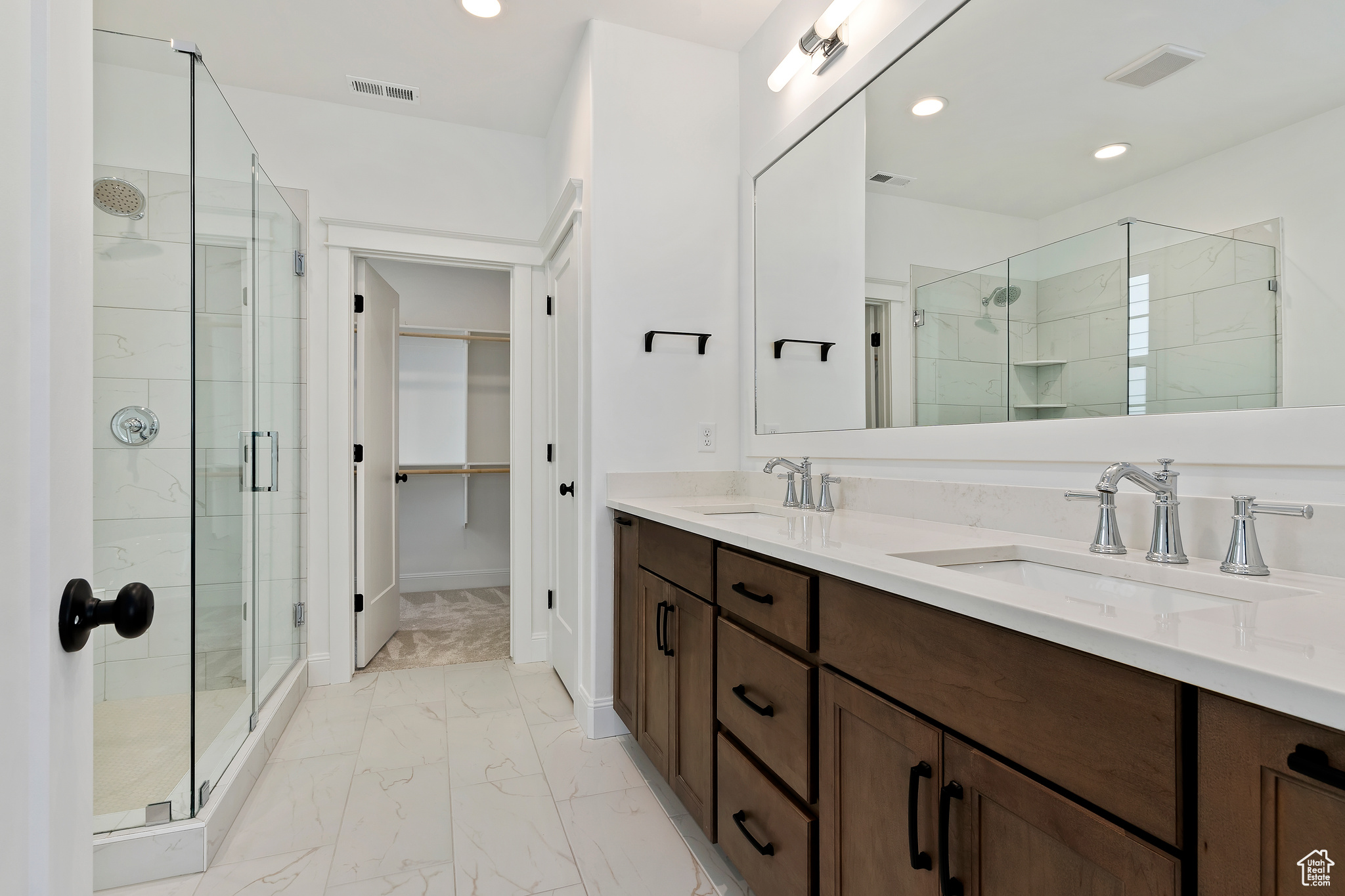 Master bathroom with heated tile floors, dual sinks, euro glass shower and 6' freestanding tub