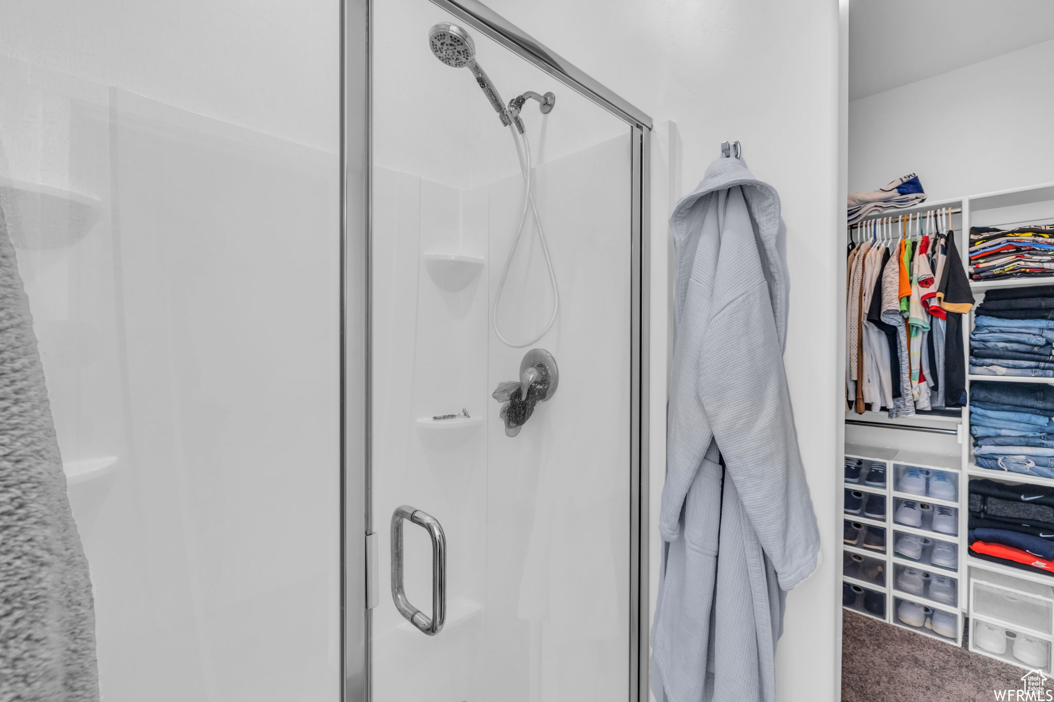 Bathroom with a shower with shower door