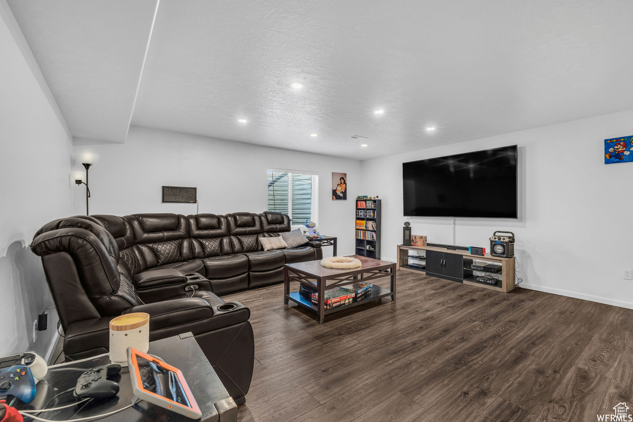 Living room with dark hardwood / wood-style flooring