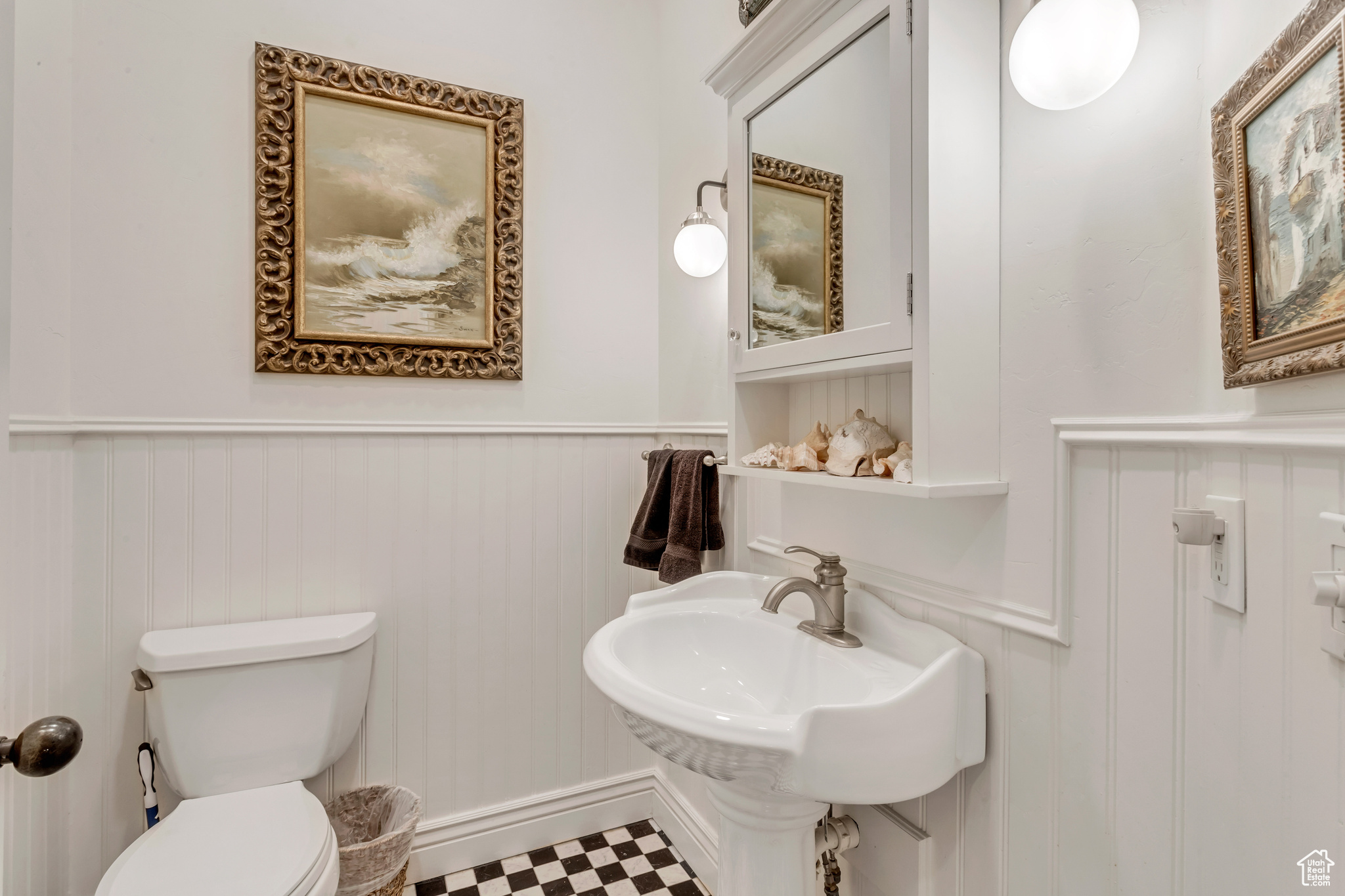 Bathroom featuring marble floors and toilet