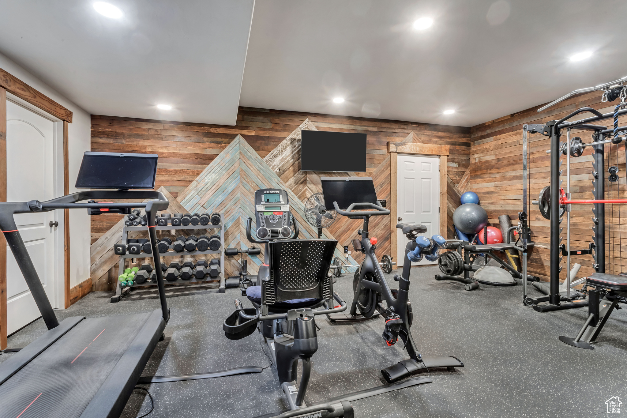 Workout area featuring wooden walls
