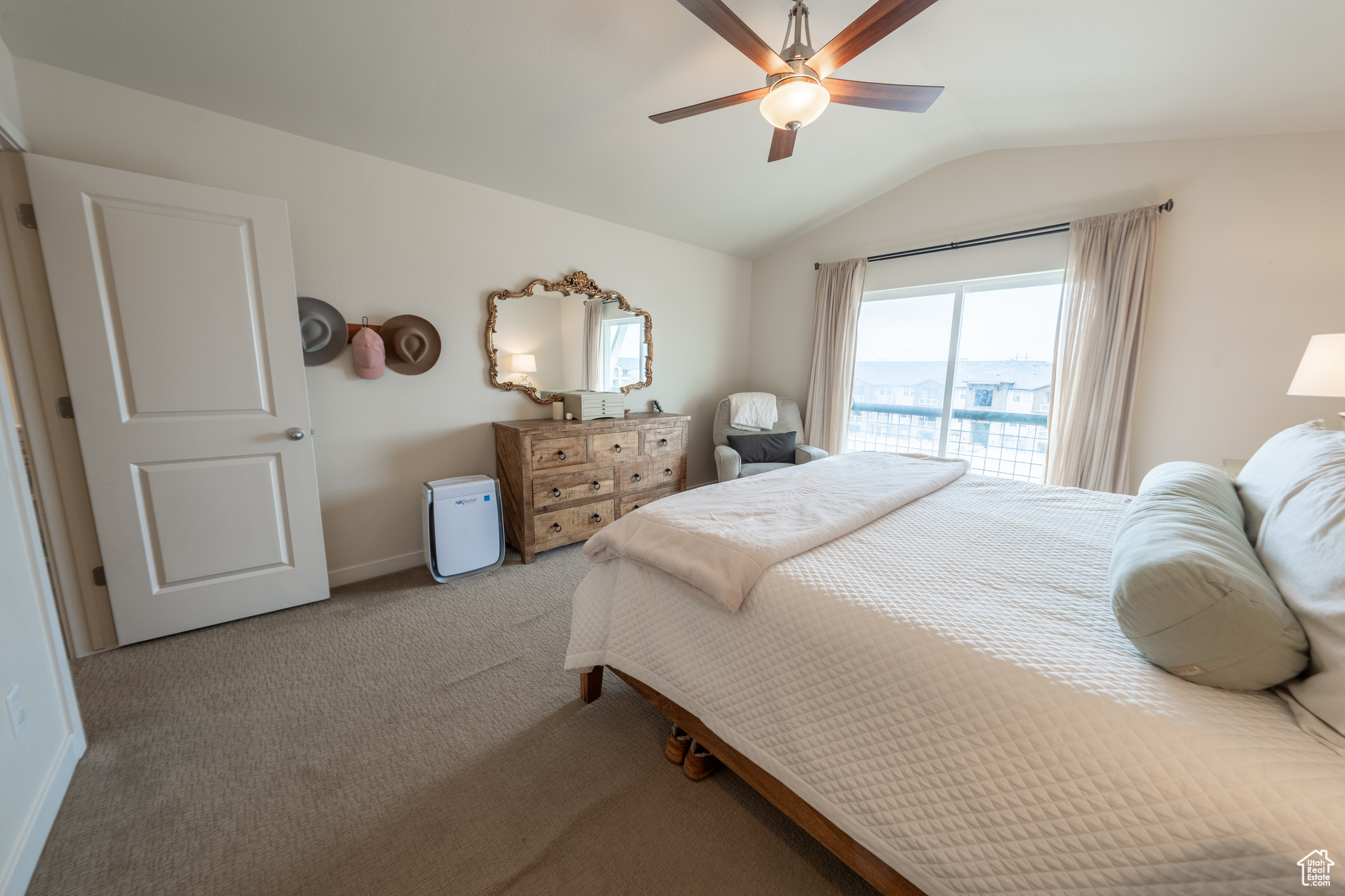 Bedroom featuring access to outside, lofted ceiling, ceiling fan, and light colored carpet