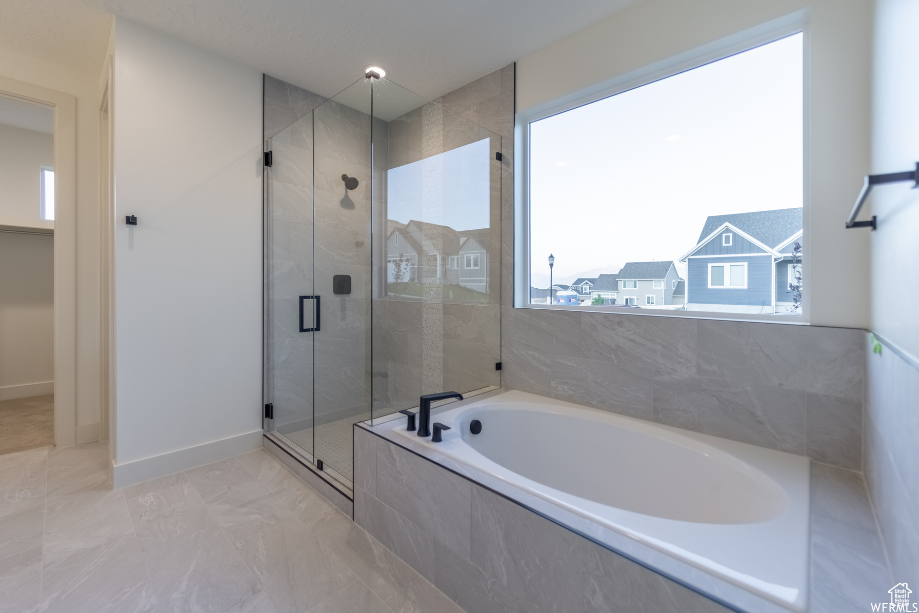 Full Euro-Glass shower with built-in garden style tub, included in base price!