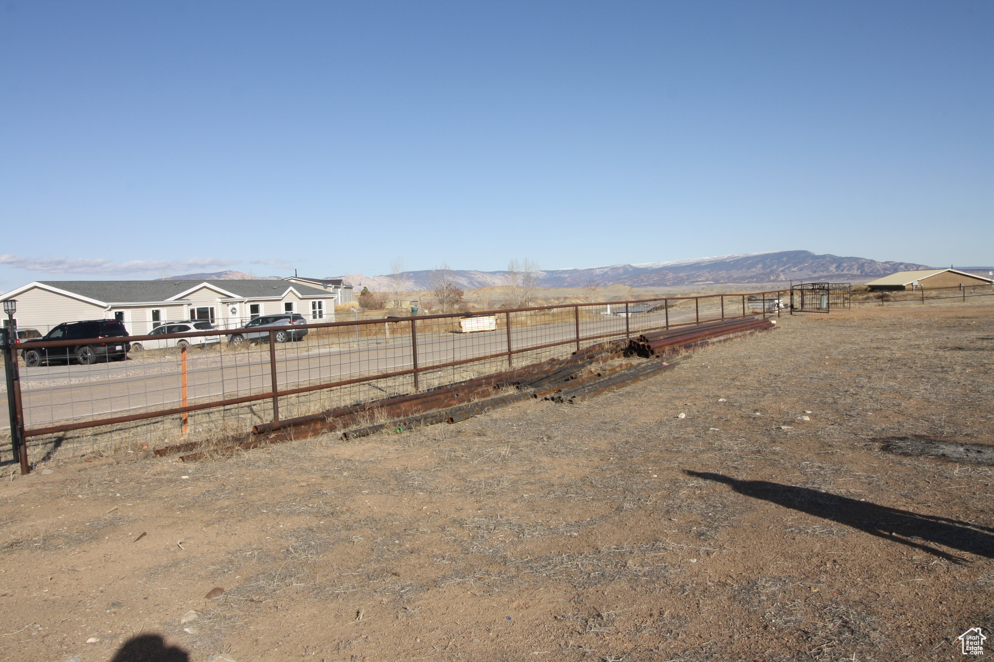 View of yard featuring a Pipe Fence, Excluded Pipe, and a mountain view