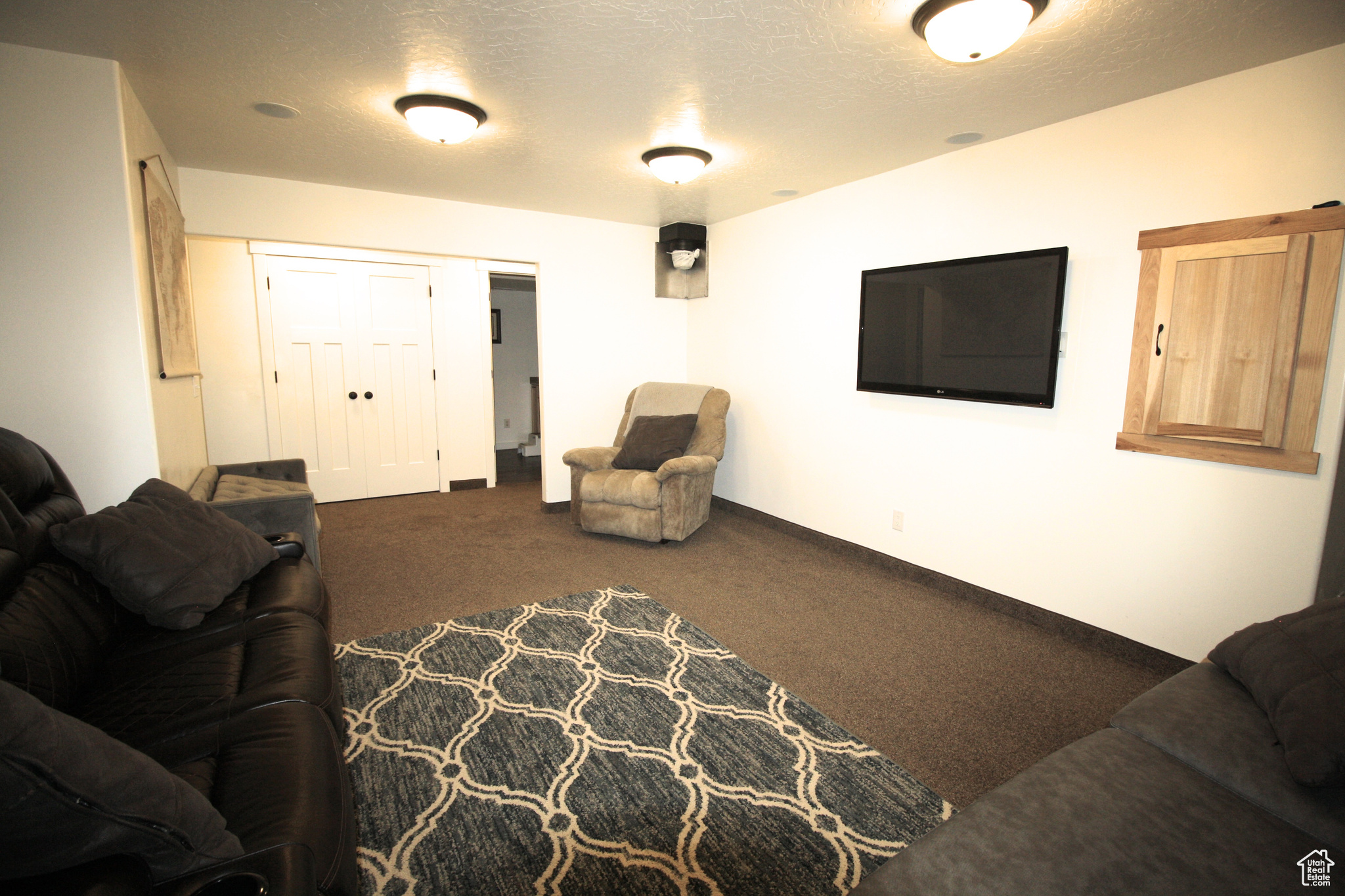 Carpeted Theater room featuring Surround Sound