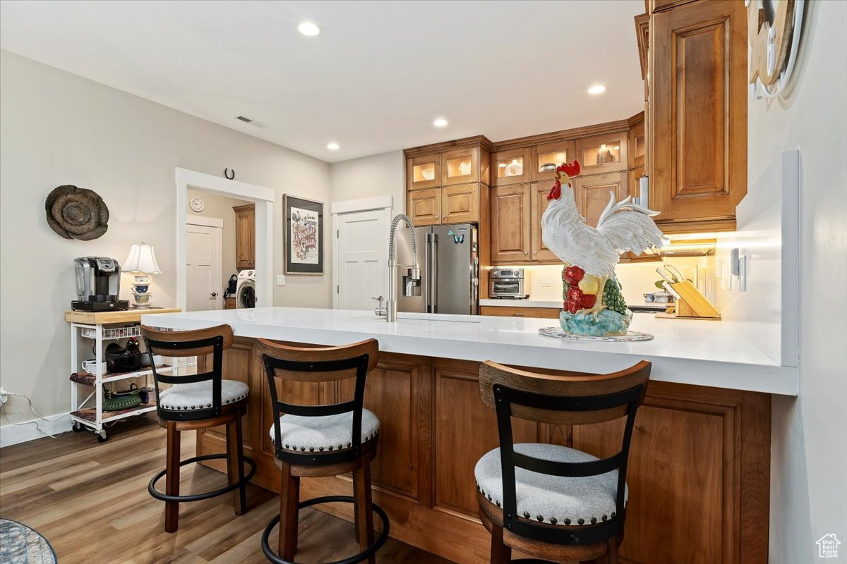 Kitchen with high quality fridge and a kitchen bar