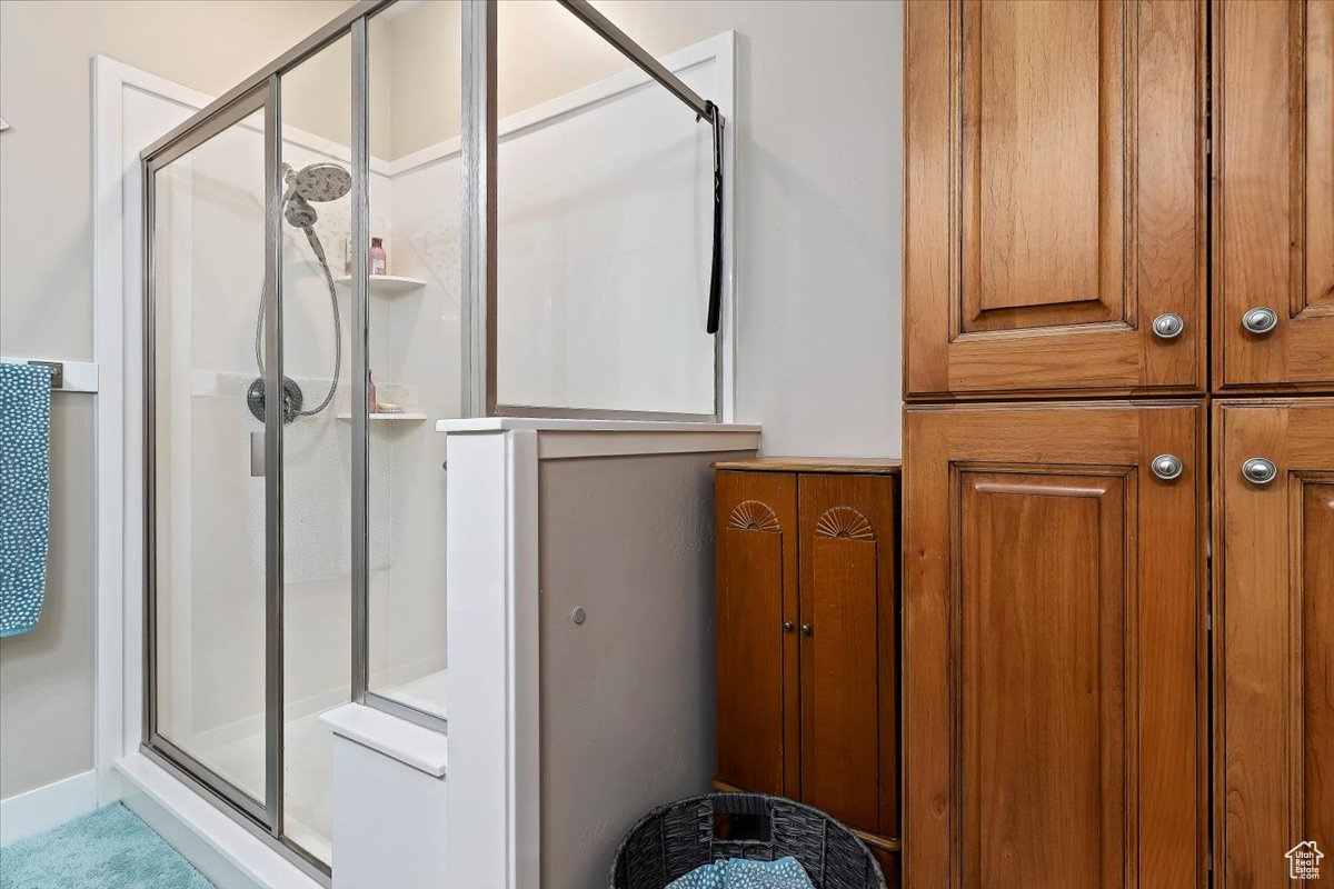 Bathroom with a shower with shower door