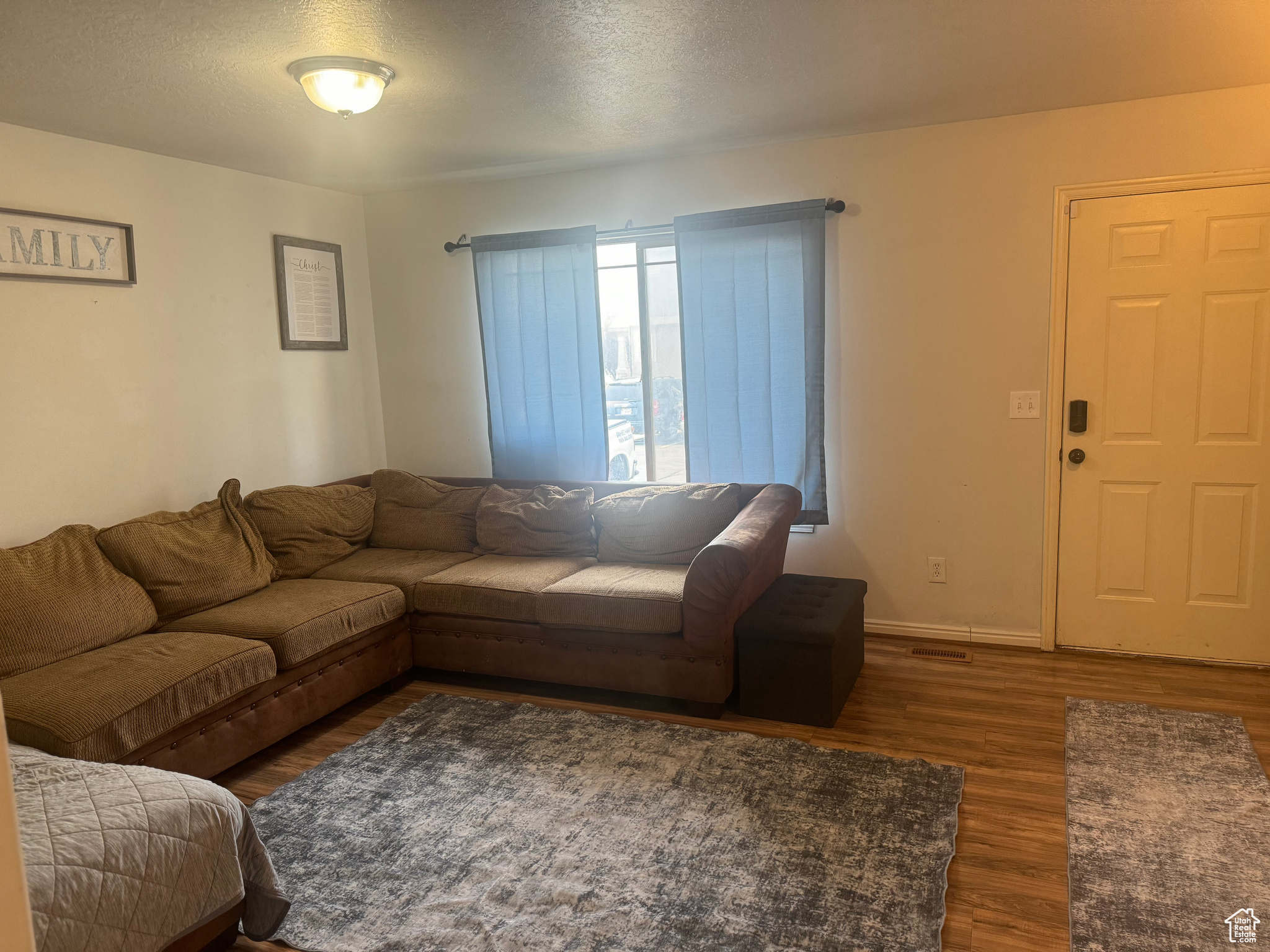 Family Room and Main Entrance with LVP wood-style flooring