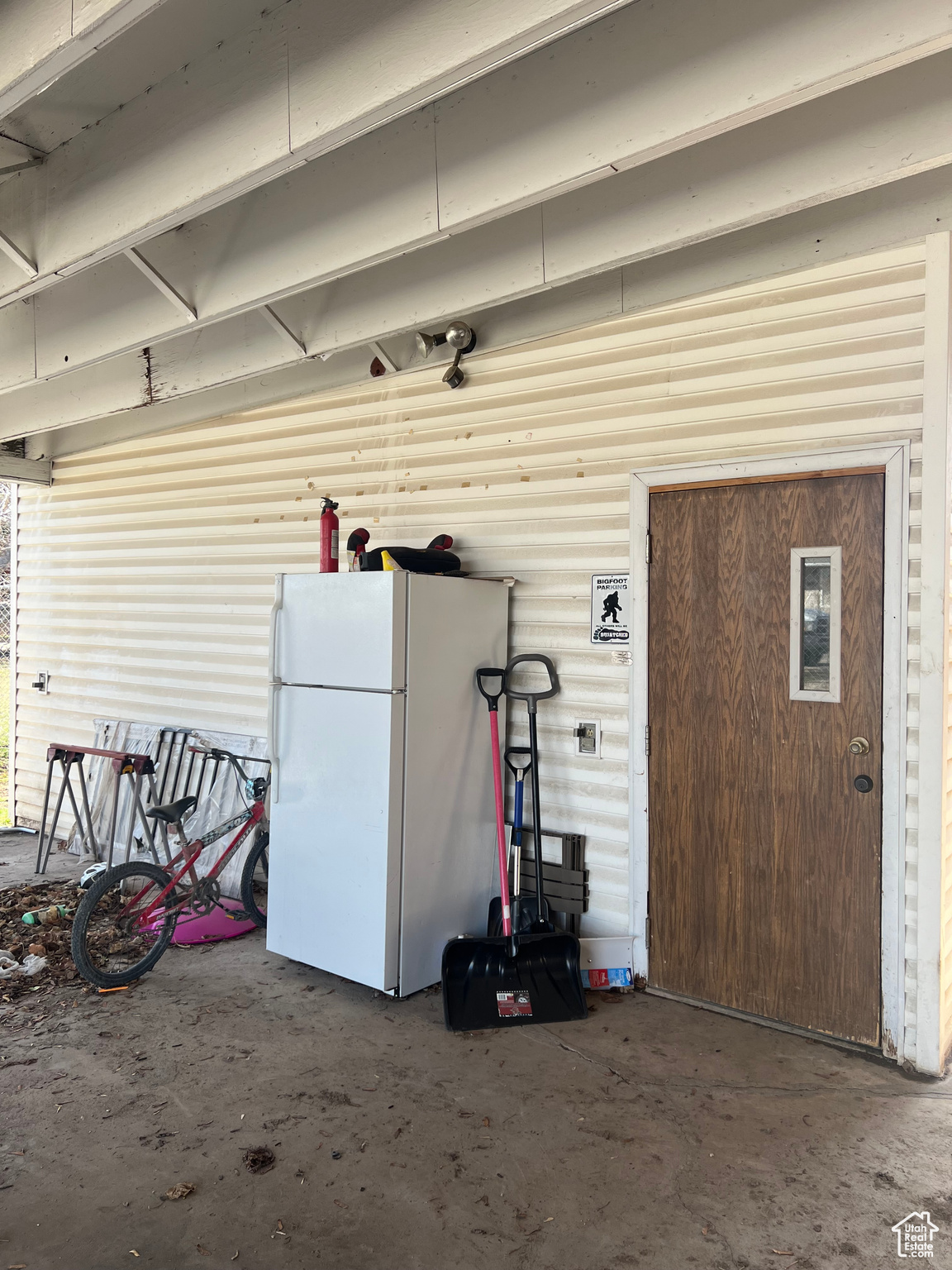 Garage with white fridge