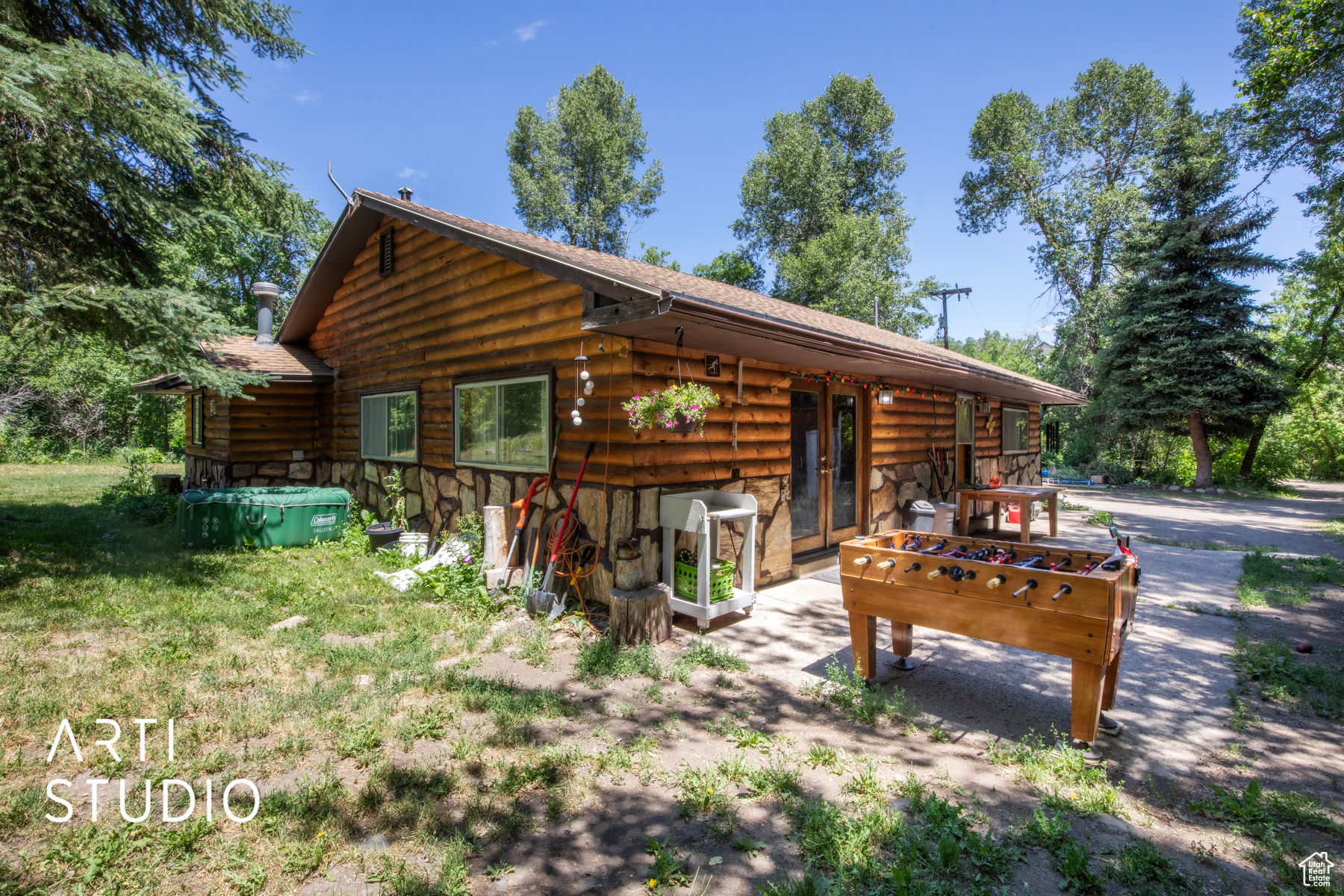 View of side of home featuring a yard