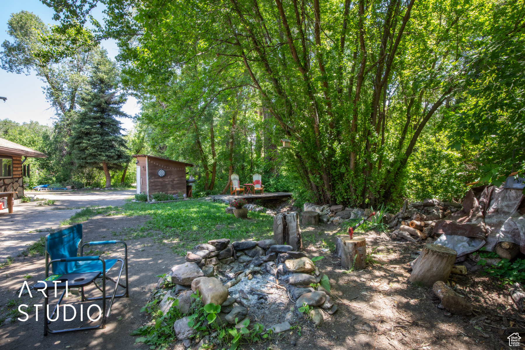 View of yard firepit and parking