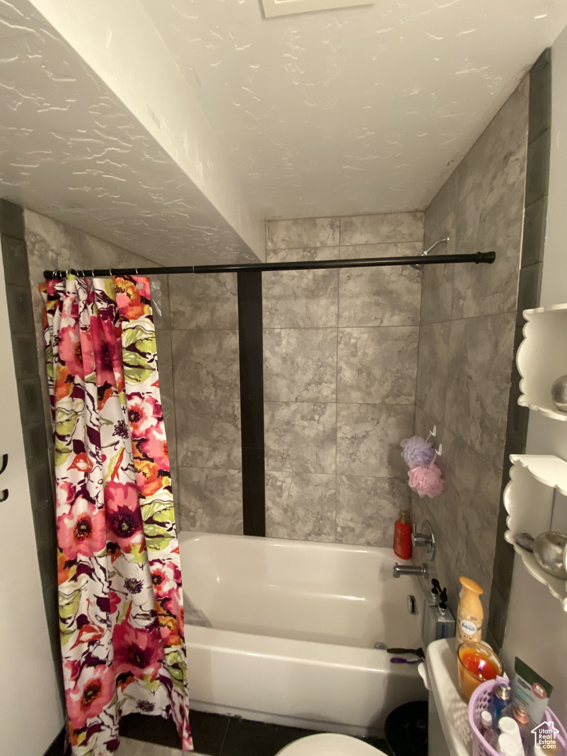 Bathroom with shower / bath combo and toilet