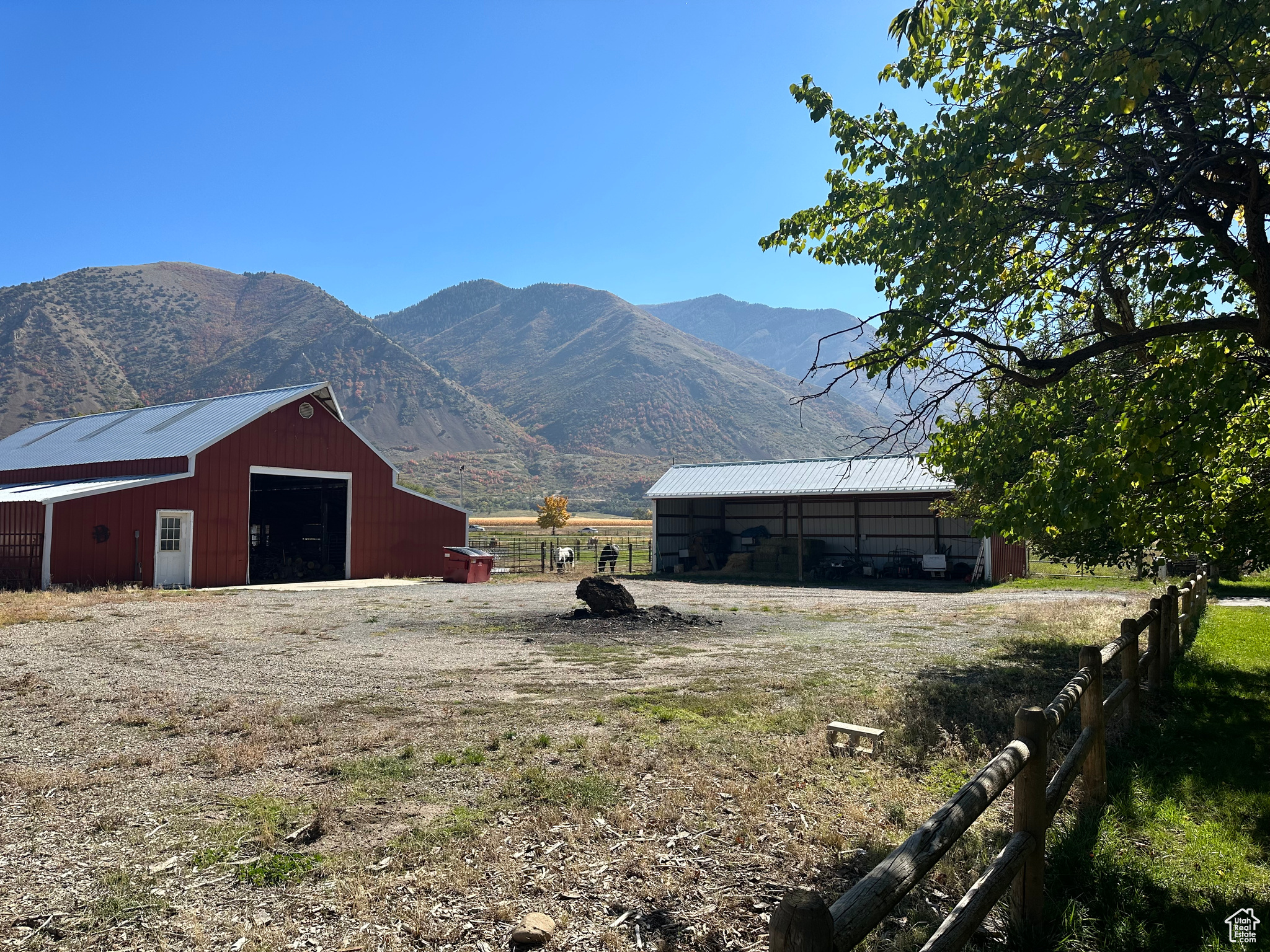 Property view of mountains featuring a rural  of barn and machine shed.