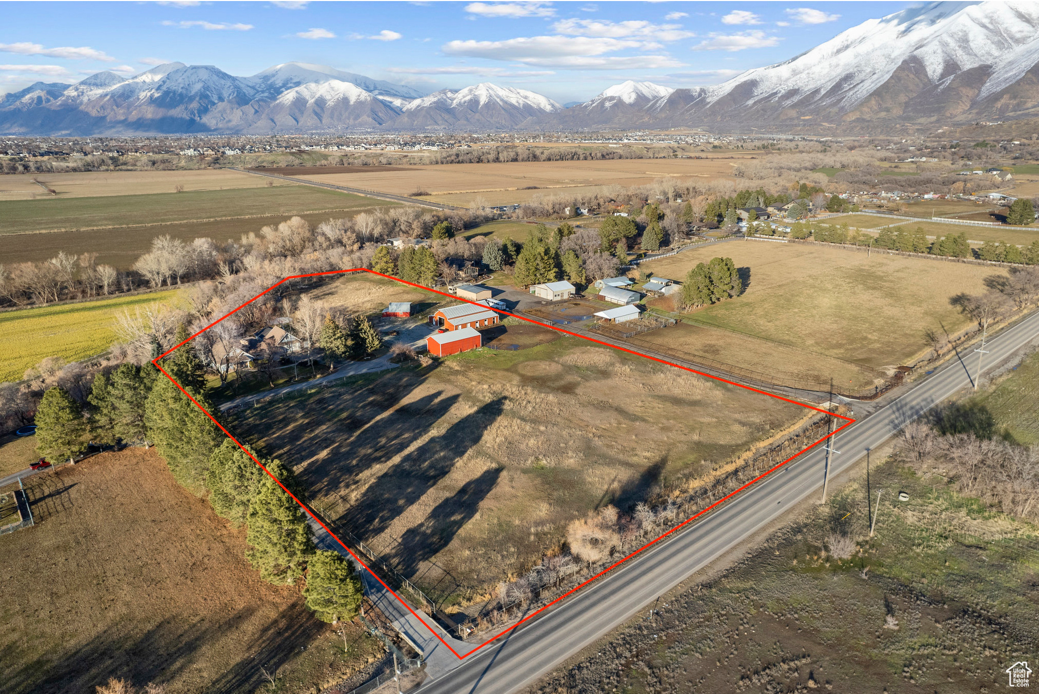 Birds eye view of property with a rural view and a mountain view looking to the northeast.