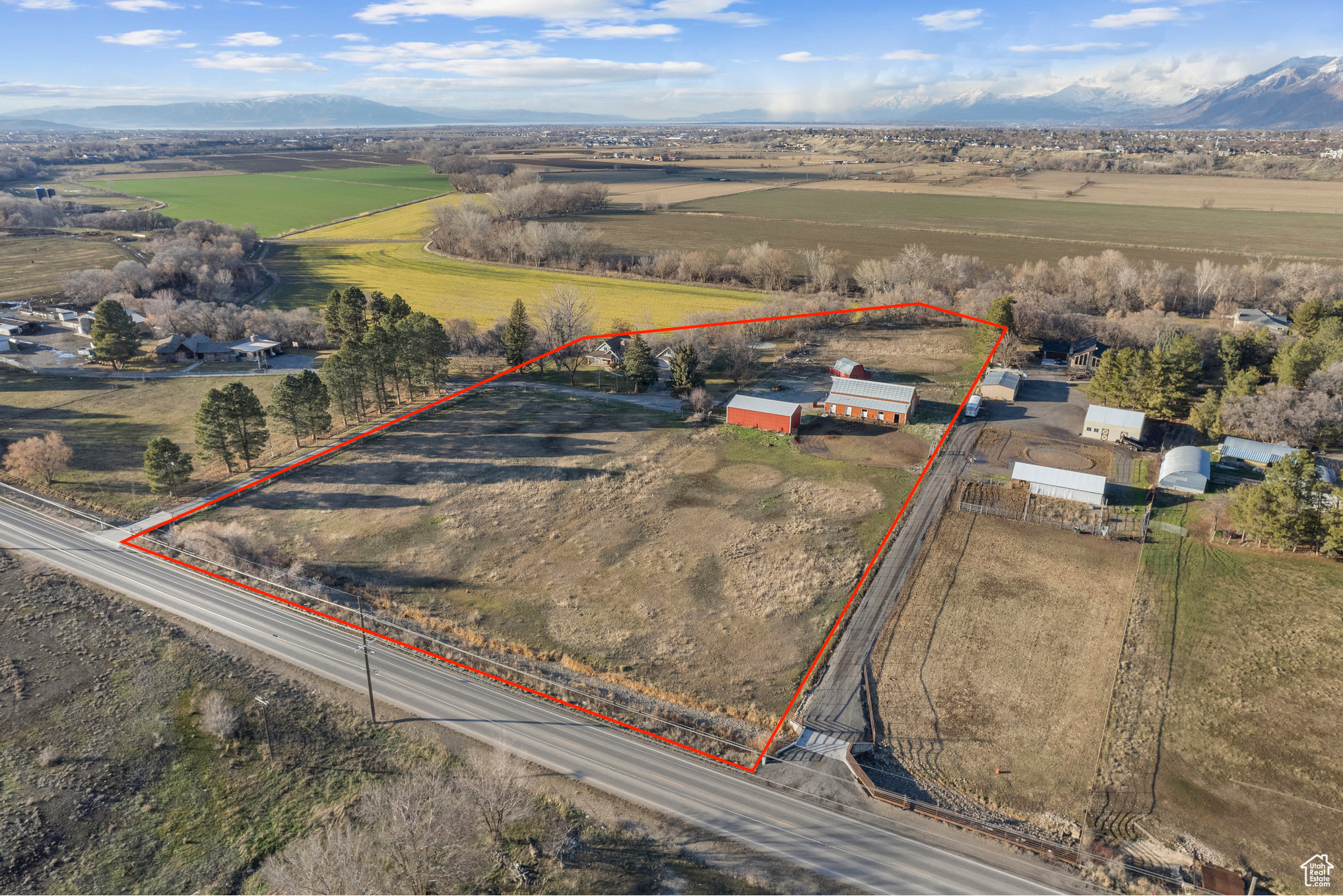 Birds eye view of property with a rural view and a mountain view looking to the northwest.