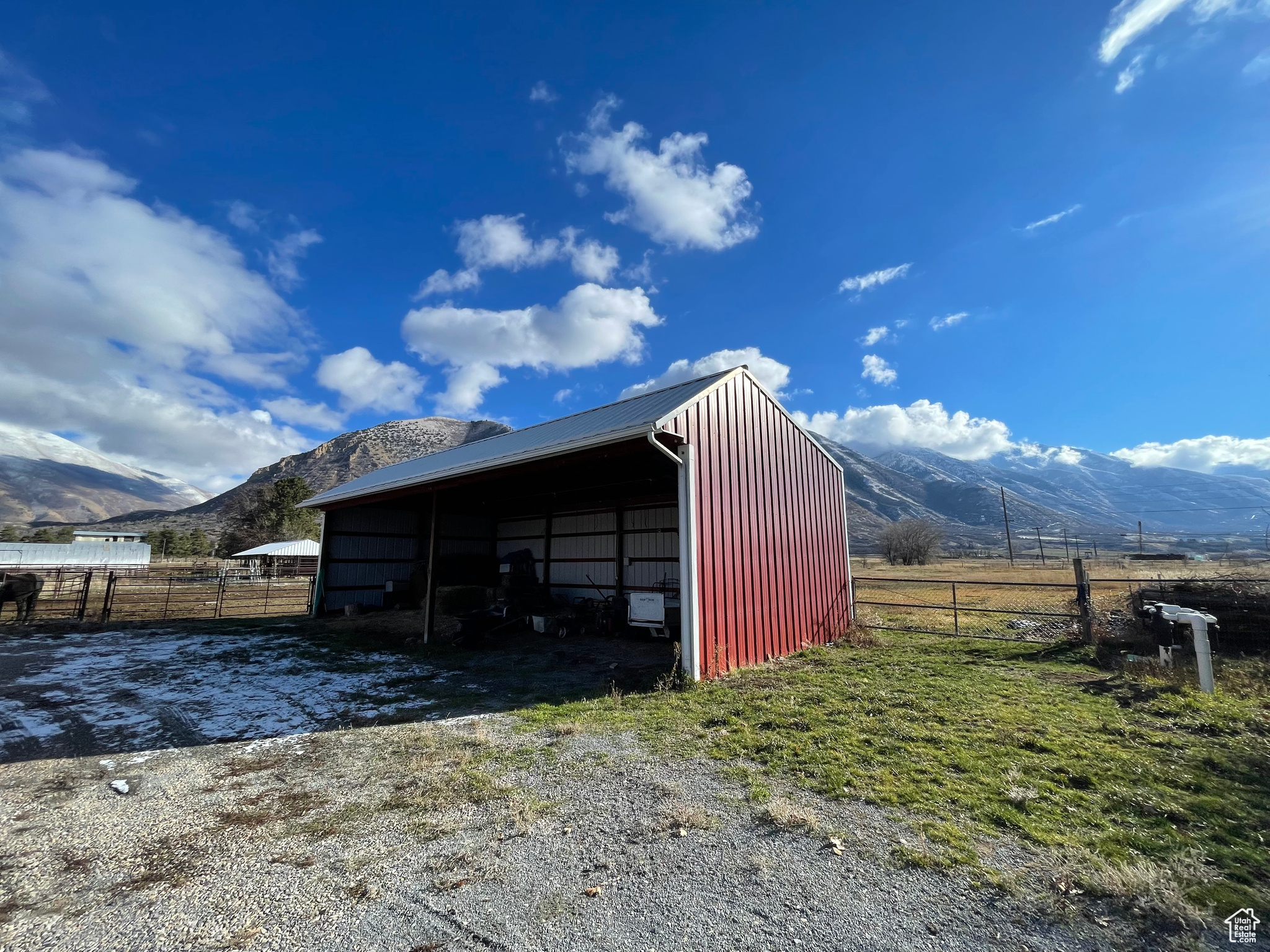 View of machine shed / structure with a mountain view, a rural view, and a carport