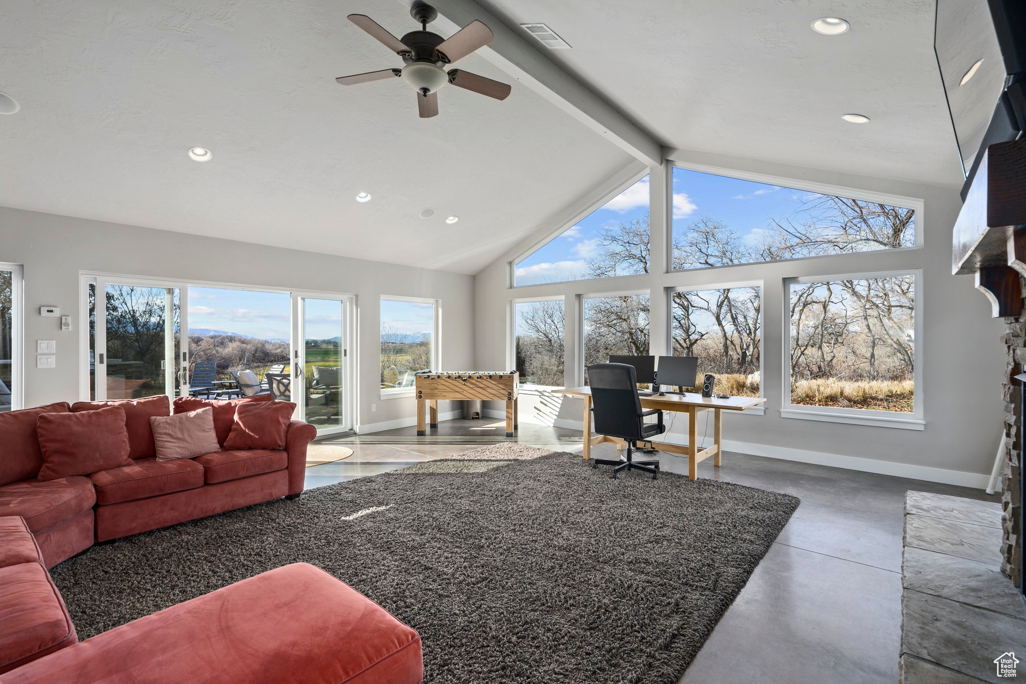 Enjoy close to 600 square feet of entertaining or gathering space in this cozy sunroom behind the garage on the north side of the home.