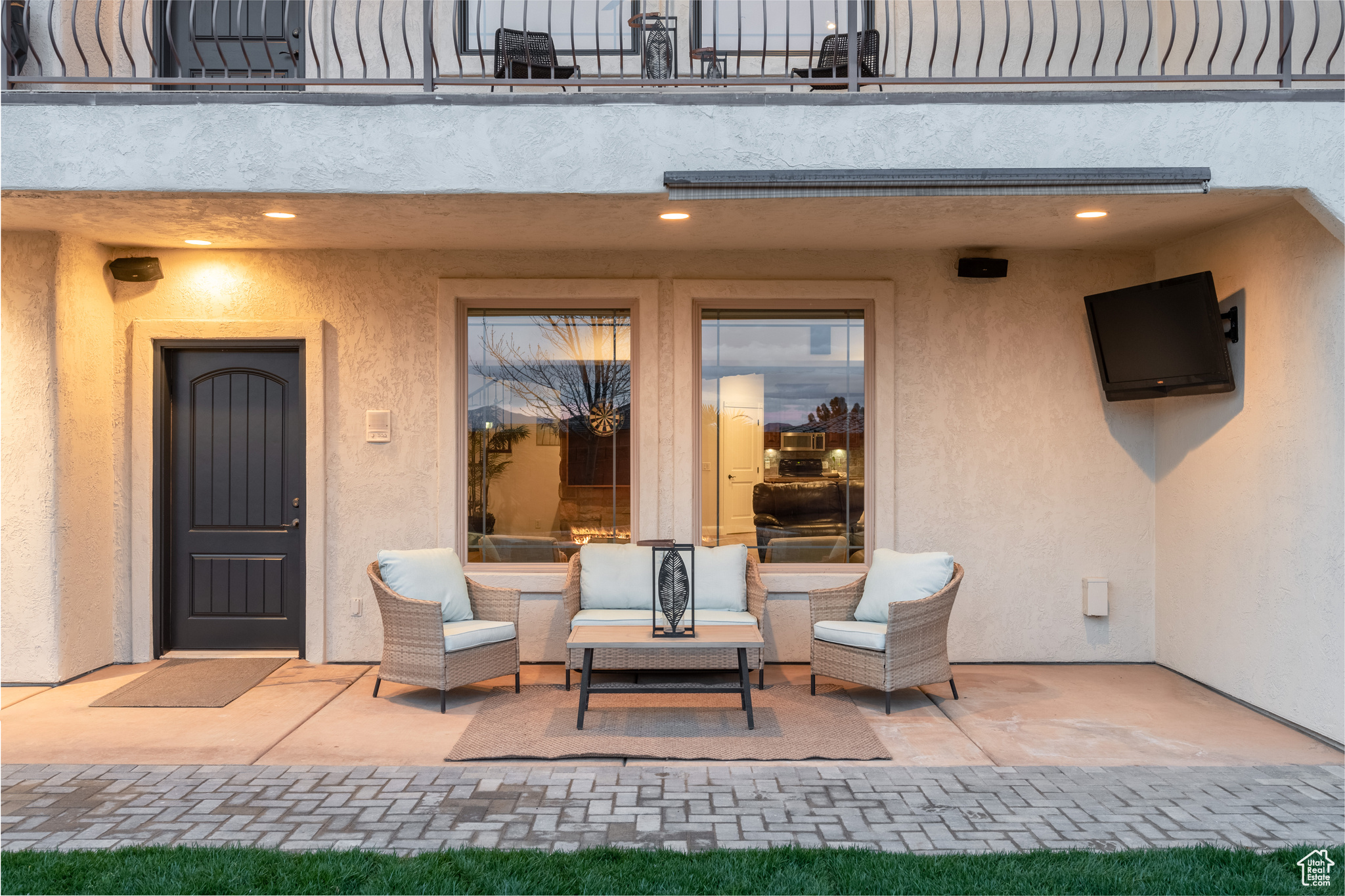 Doorway to property featuring a balcony, a patio, and outdoor lounge area