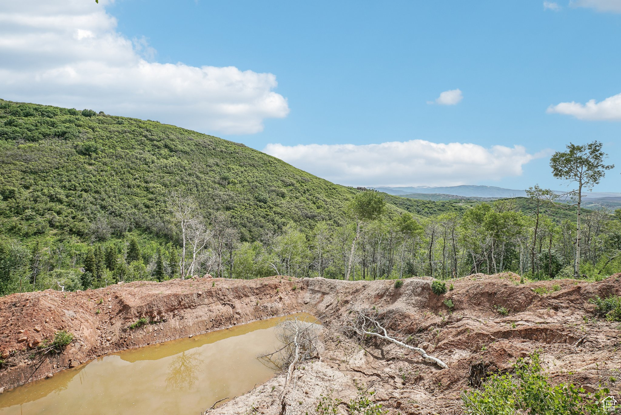 Property view of mountains featuring a water view