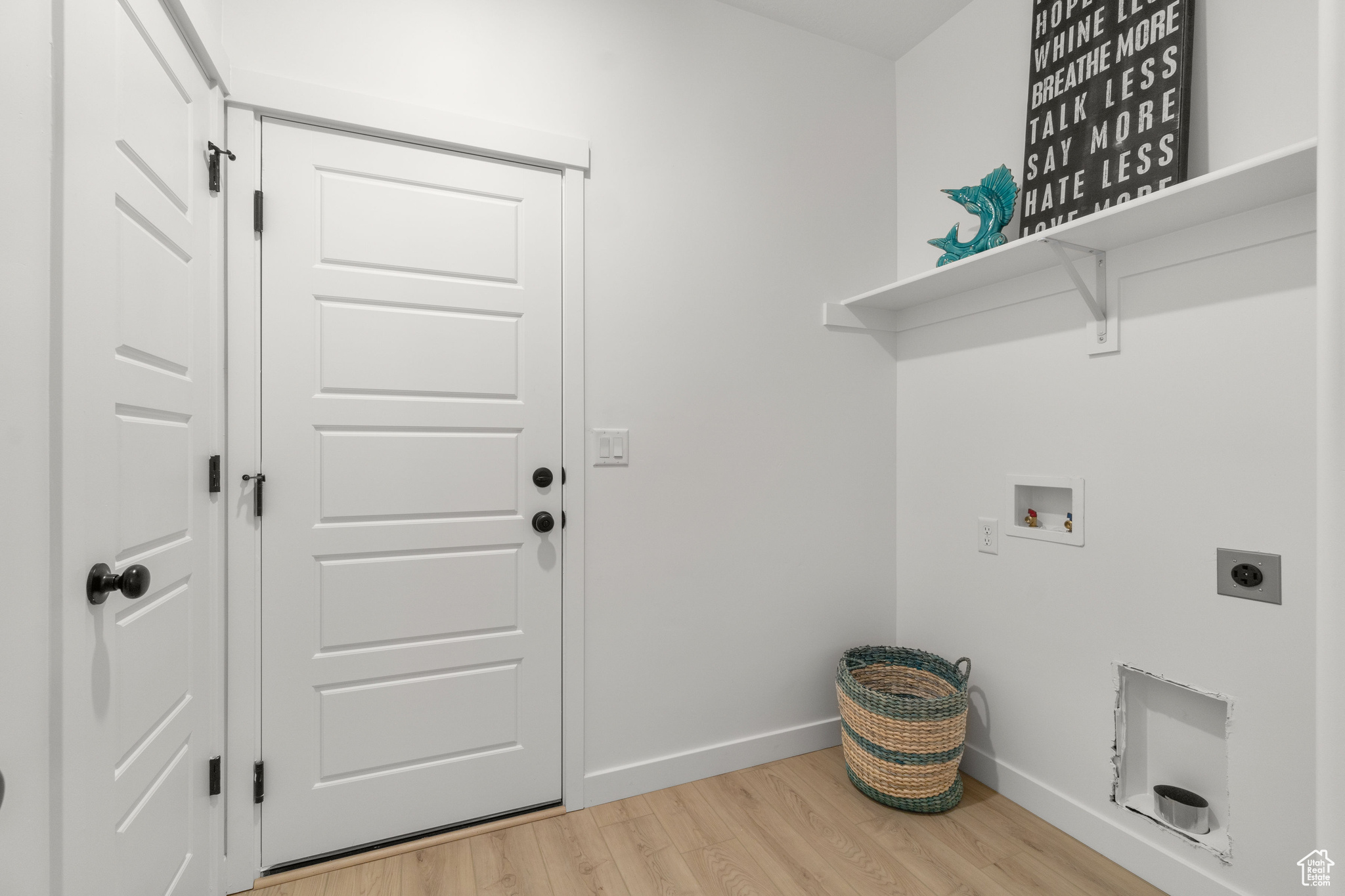 Laundry room with light hardwood / wood-style floors, hookup for an electric dryer, and washer hookup