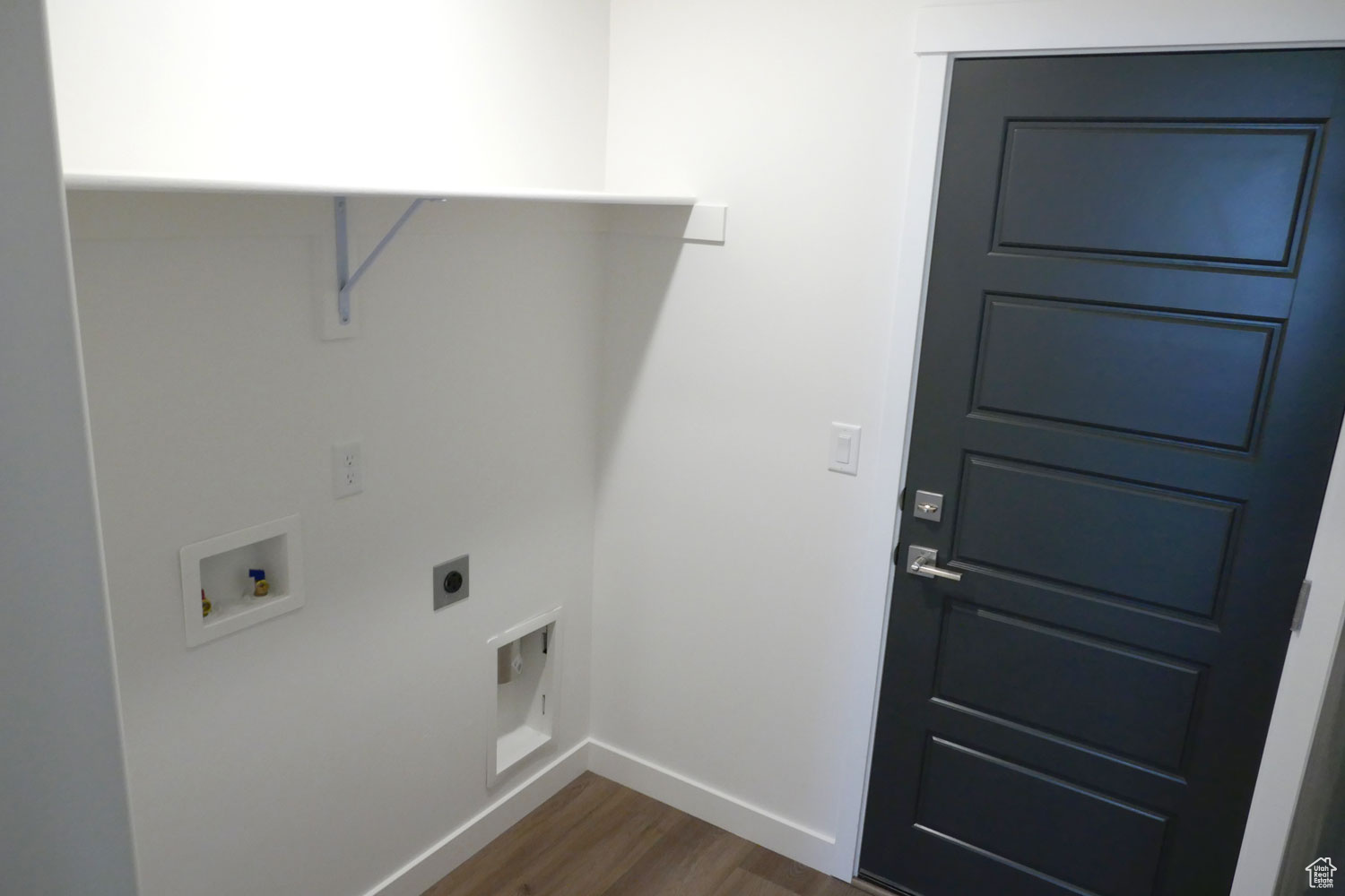Laundry area featuring washer hookup, dark hardwood / wood-style floors, and electric dryer hookup
